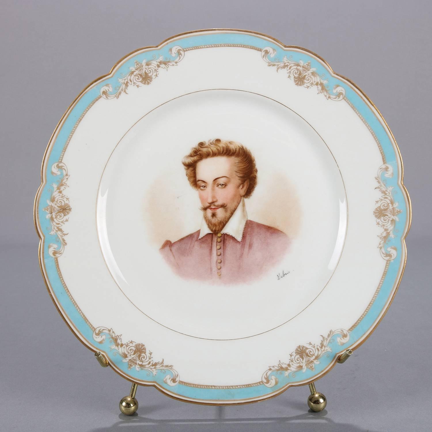 Antique French portrait plate by Sevres for Chateau de St Cloud features well with central artist signed portrait of Henry IV by Debrie and framed, rim with gilt scalloped edges and decorated blue and foliate gilt motif, en verso stamped 