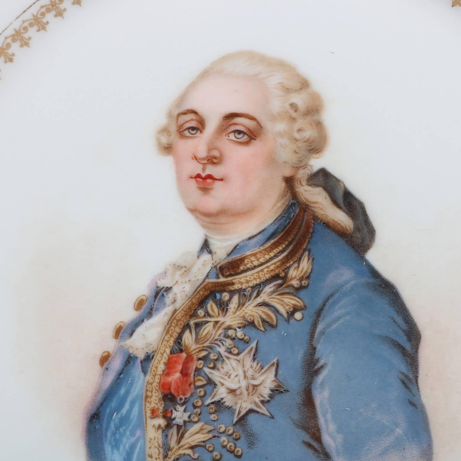 Antique French portrait plate by Sevres for Chateau de St Cloud features well with central artist signed portrait of Louis XVI by Debrie and framed with gilt repeating and stylized fleur-de-lis pattern, rim with gilt scalloped edges and decorated