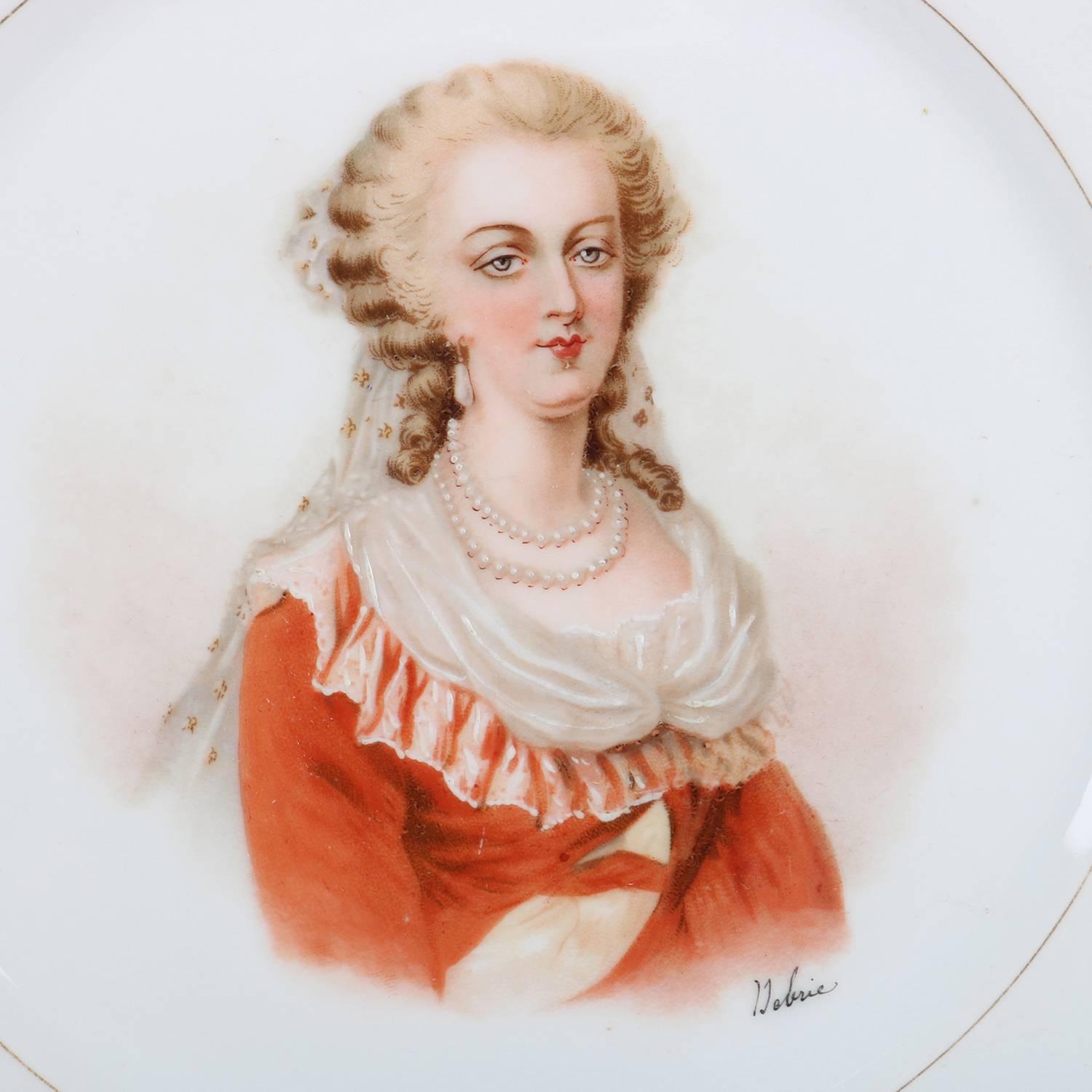 Antique French portrait plate by Sevres for Chateau de St Cloud features well with central artist signed portrait of Marie Antoinette by Debrie, rim with gilt scalloped edges and decorated with rose pink and gilt rope twist and foliate motif, en