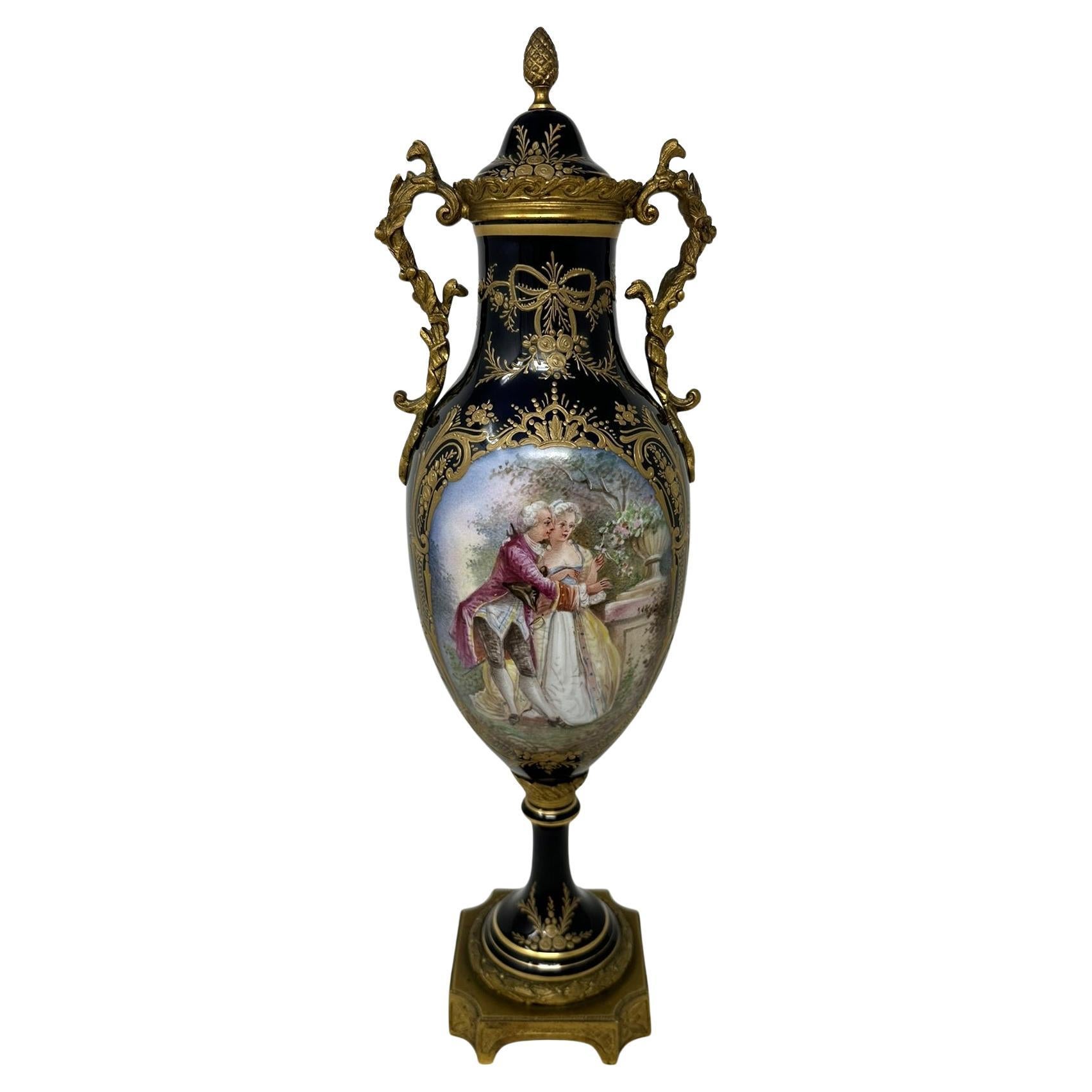 Stunning imposing Pair of French Sevres Style Soft Paste Porcelain and Ormolu Twin Handle Electric Table Lamps of traditional bulbous form, and of good size proportions, raised on a very ornate dome shaped circular porcelain base on a plain square