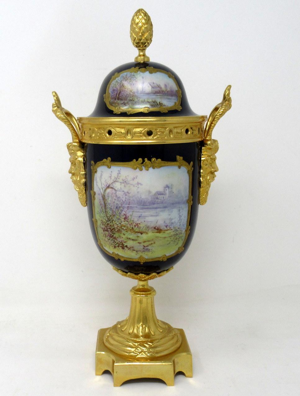 Stunning French Sevres soft paste porcelain and ormolu twin handle table or mantle urn of traditional form and of outstanding quality, and good size proportions, raised on a plain square stepped base with canted corners. 

The twin handles