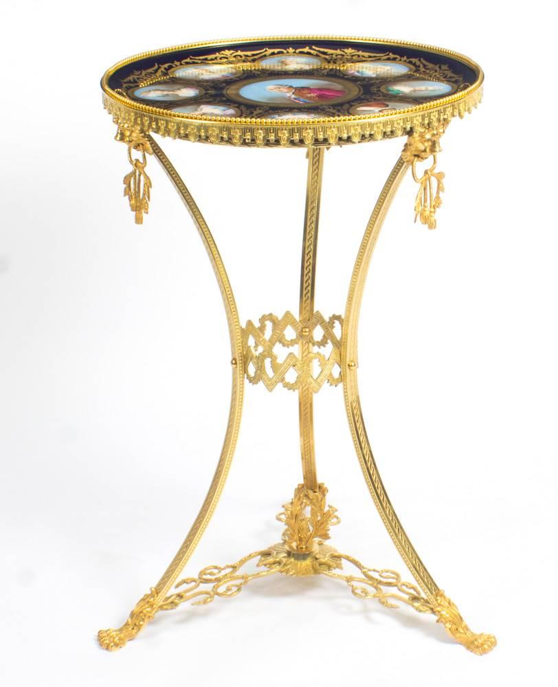 This is an important decorative antique French gilt bronze table with Sevres porcelain top featuring portraits of Louis XVI and important female members of his court, including Marie Antoinette and his daughters and dating from the late 18th