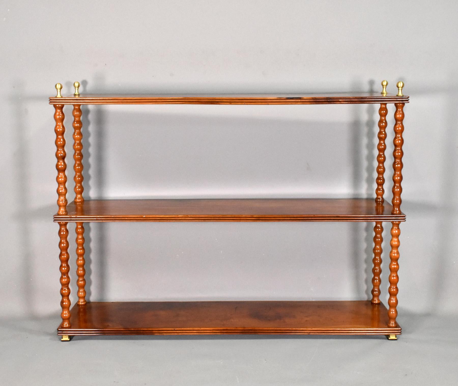 Antique French shelving unit in cherry wood.

This free-standing etagere / shelving unit has three solid cherry wood shelves with beautifully figured wild grain and triple moulded edges to three sides. 

The shelves are separated by