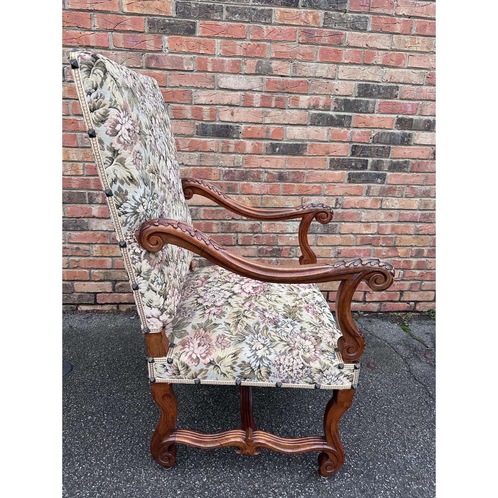 This is a beautiful antique needle point chair! They have been adorned in in hues in soft green and rose tones and pair wonderfully with the rich wood. The arms and legs have stunning hand carved designs that are immediately eye-catching. These