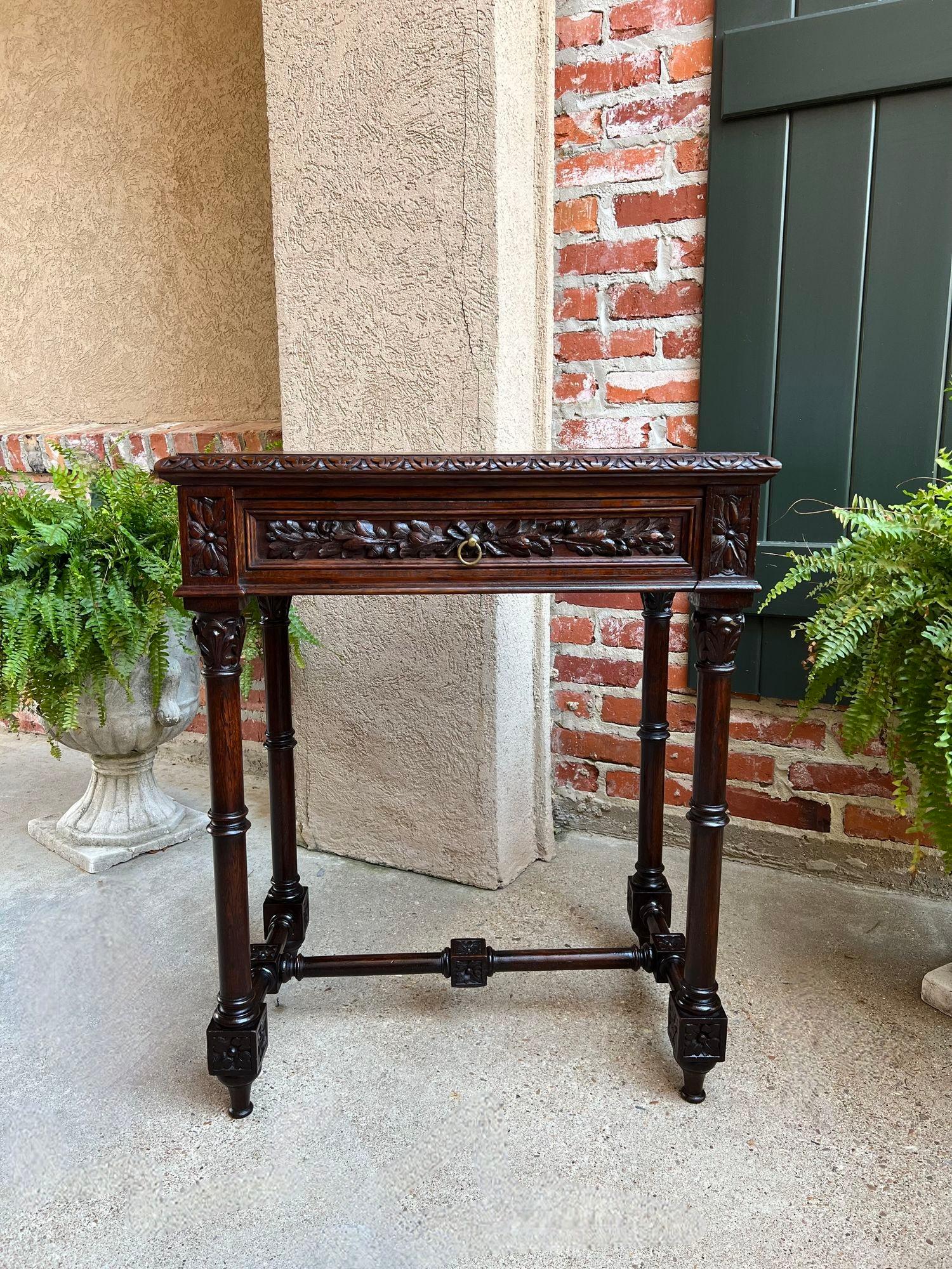 Antique French Side Sofa Hall Table Carved Dark Oak Renaissance End Table.

Direct from France, a very highly carved and elegant antique French hall table in a perfect small size for anywhere from your foyer to sofa to bedside!
The opulent carvings