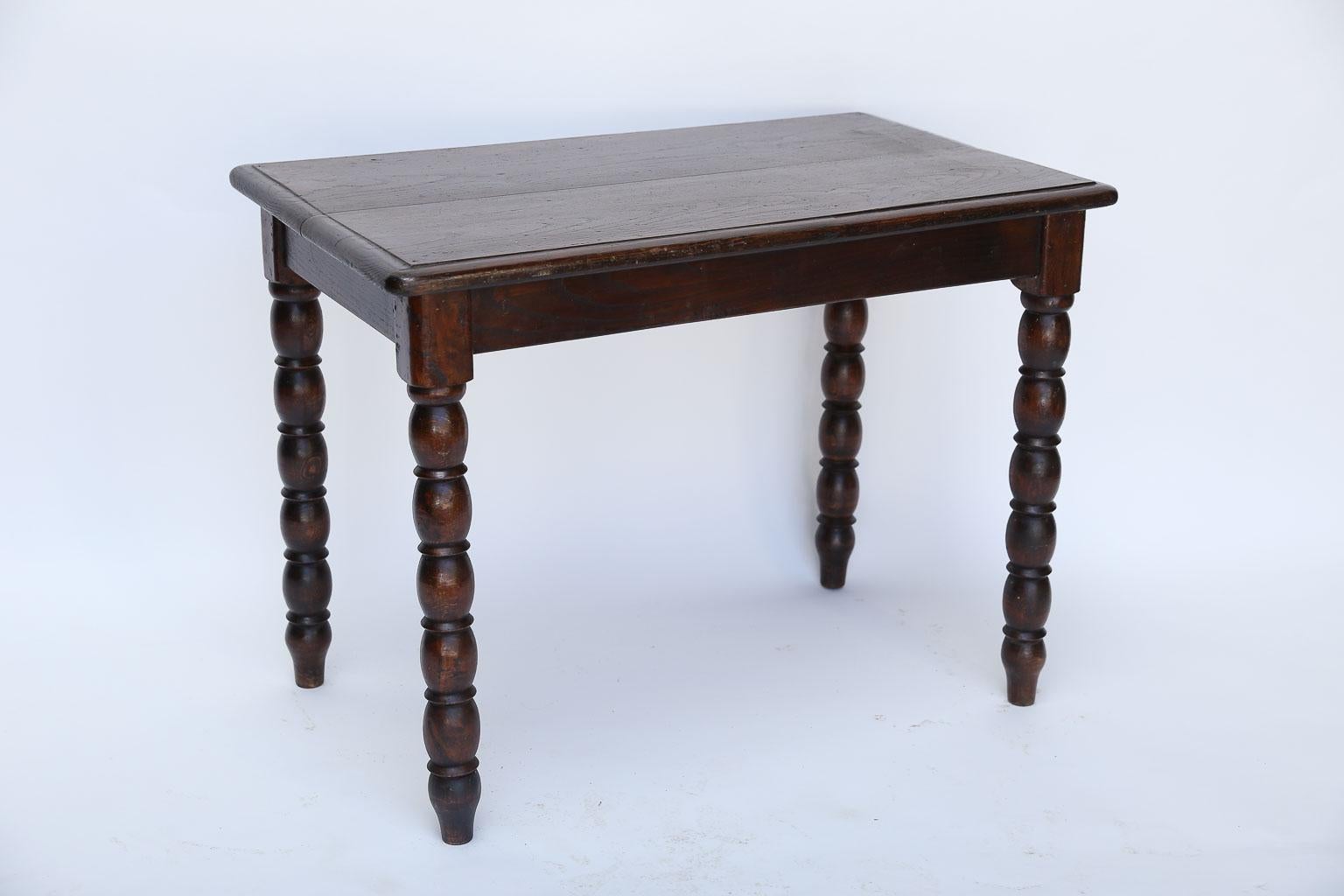 Lovely antique French side table with rectangular top supported on four bobbin turned legs. The table has a warm, dark finish and could be used as a side table or high tea table.