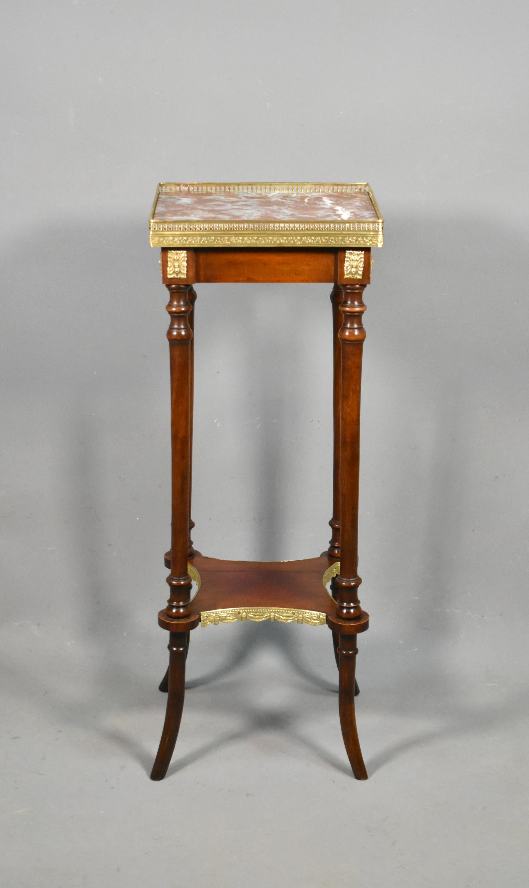 Antique French side table Louis XVI style.

A delightful French centre table featuring a red and white marble top surrounded by a pierced brass gallery with floral decoration. 

The piece has finely turned legs leading down to a delicately