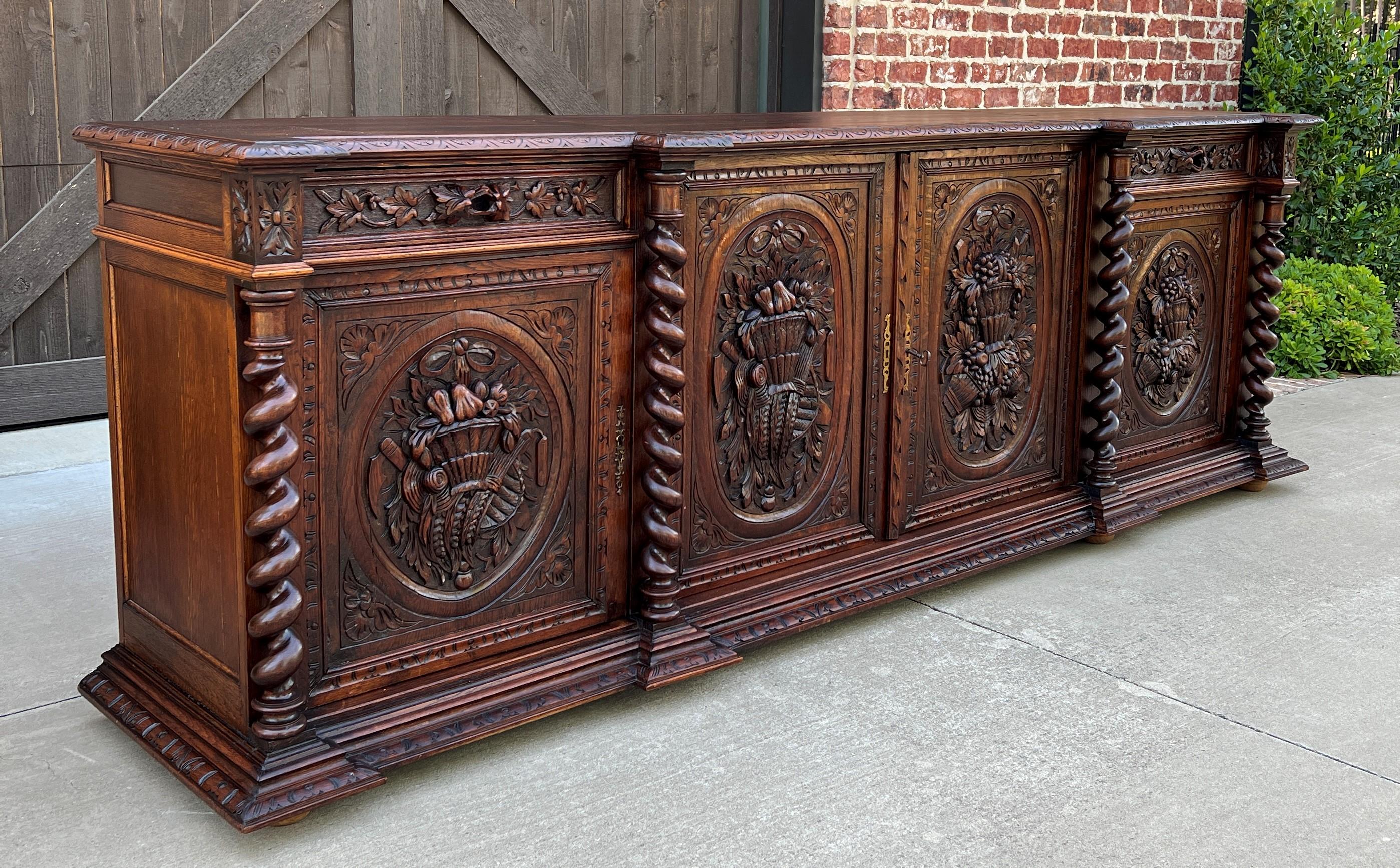 Gorgeous antique French renaissance revival wide oak sideboard, server, or buffet~~4 barley twist posts~~2 drawers and 4 lower cabinets~~ornate carvings~~c. 1880s-1890s

Hard to find large/wide oak sideboard, server or buffet with barley twist