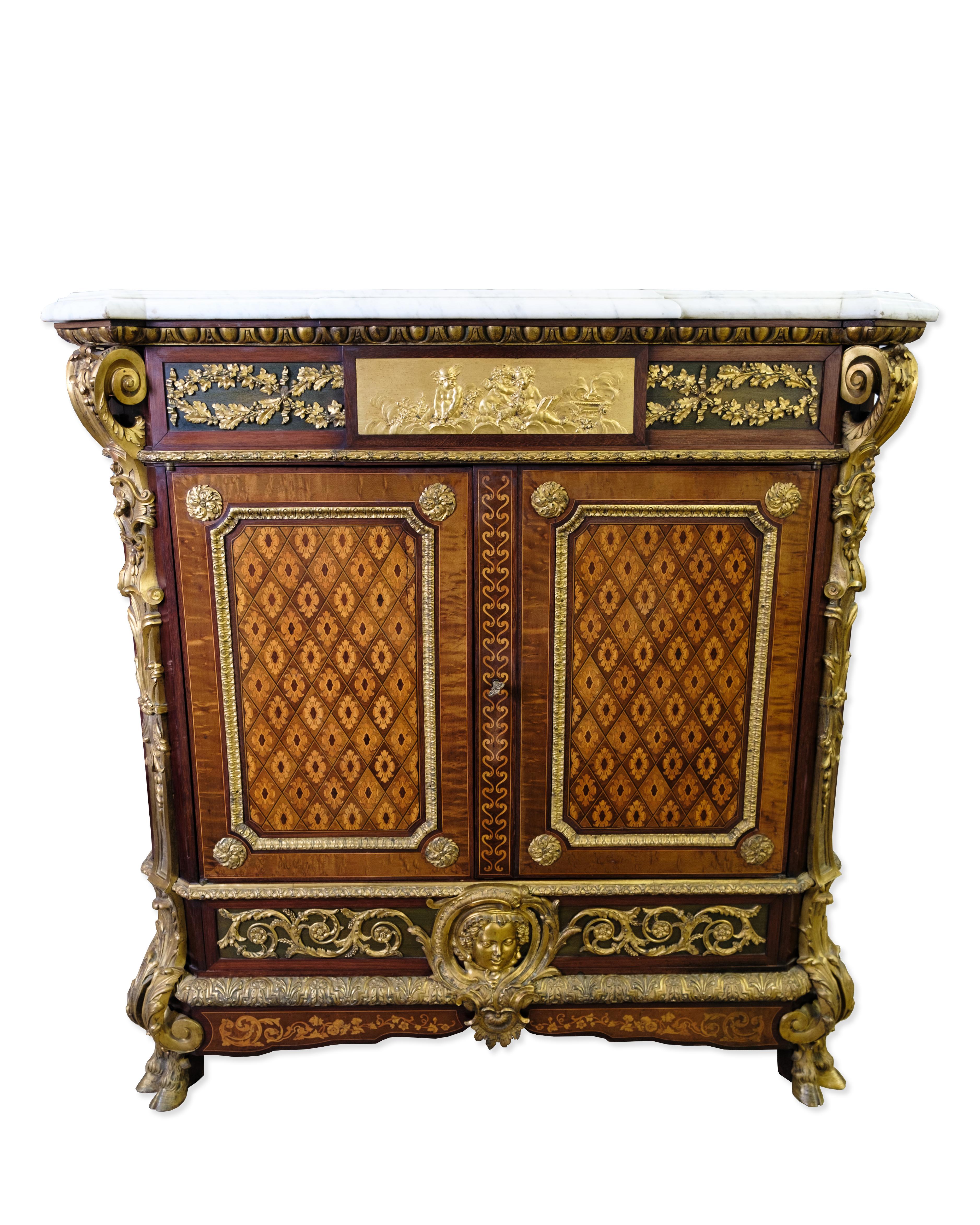 Antique French Empire style inlay sideboard. The sideboard features detailed inlay inlay. The central design is inlaid in walnut wood, which is surrounded by a beautiful inlay pattern. The cabinet is made up of walnut, kingwood and softer fruitwoods