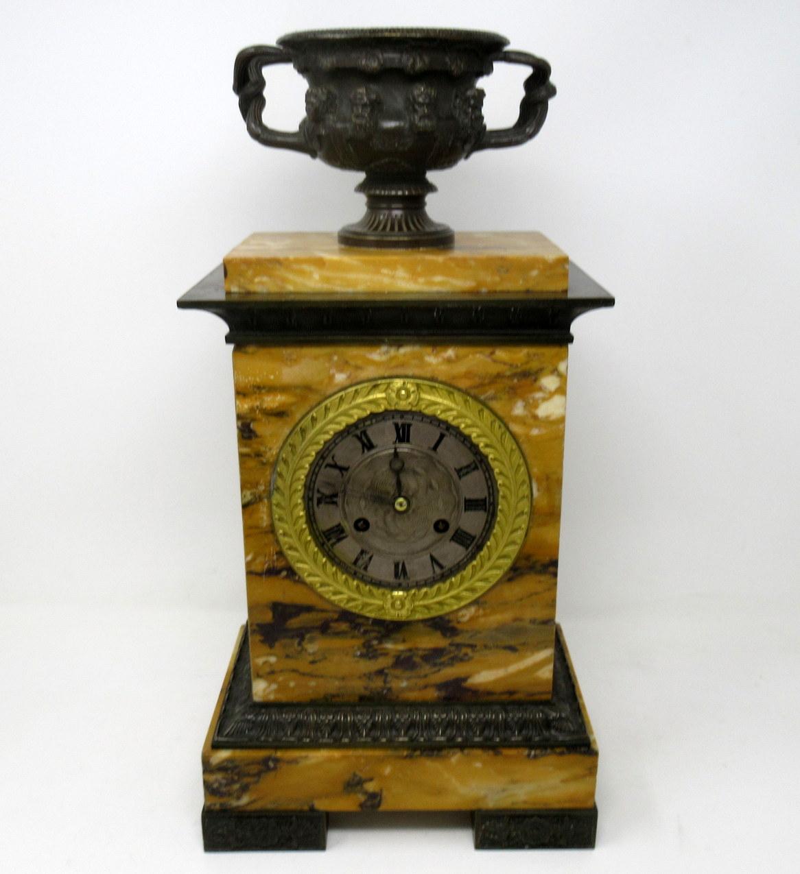 An exceptional well figured Sienna marble and finely cast patinated bronze mantel (fireplace) clock by the superb French clockmaker Honoré Pons, (1773-1851), first half of the 19th century.

The stunning example is mounted with a bronze model of