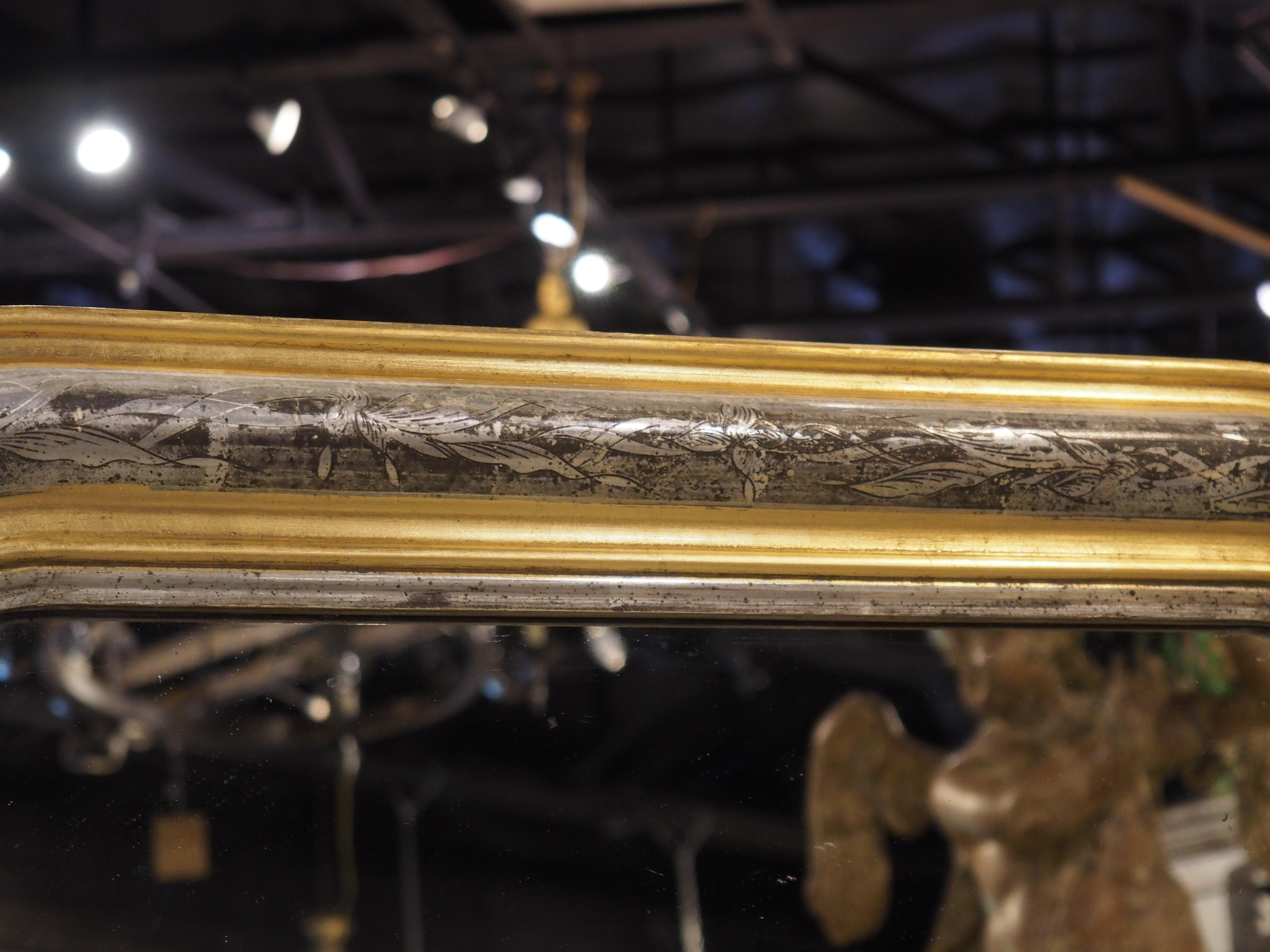 More information coming soon…

A French Louis Philippe-style mirror from the early 1900s.  Alternating moldings of silver and gold, with floral hand-carved motifs.