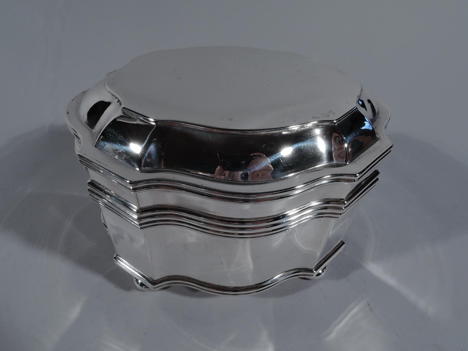 Classical 950 silver box. Made by Auguste Leroy in Paris, circa 1920. Curvilinear shaped oval. Cover hinged and raised. Four ball supports. An elegant keepsake casket. Marked with maker’s stamp and Minerva head. Weight: 14.5 troy ounces.