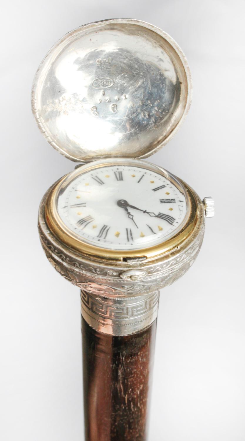This is a beautiful and distinctive antique French Gentlemans ebonised opera cane walking stick with the exquisite silver watch fashioned into the handle, dating from Circa 1880.
 
The watch having a decorative silvered dial and cylinder
