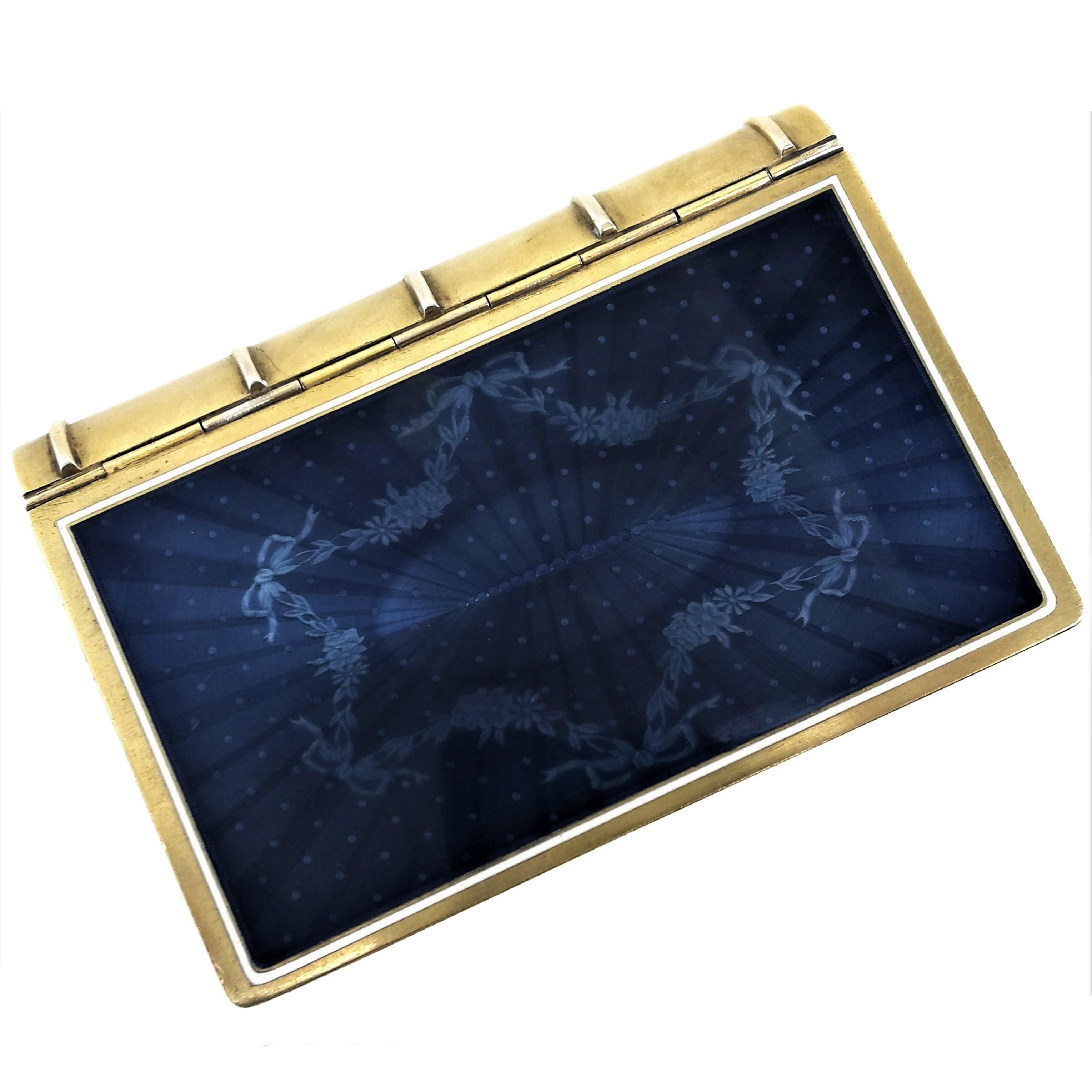 A gorgeous Antique French Silver and Enamel Writing Set or Desk Set encased in a silver and enamel box shaped like a book. The hinged front 'cover' features an iridescent deep blue guilloche enamel design on the exterior and interior surfaces. The