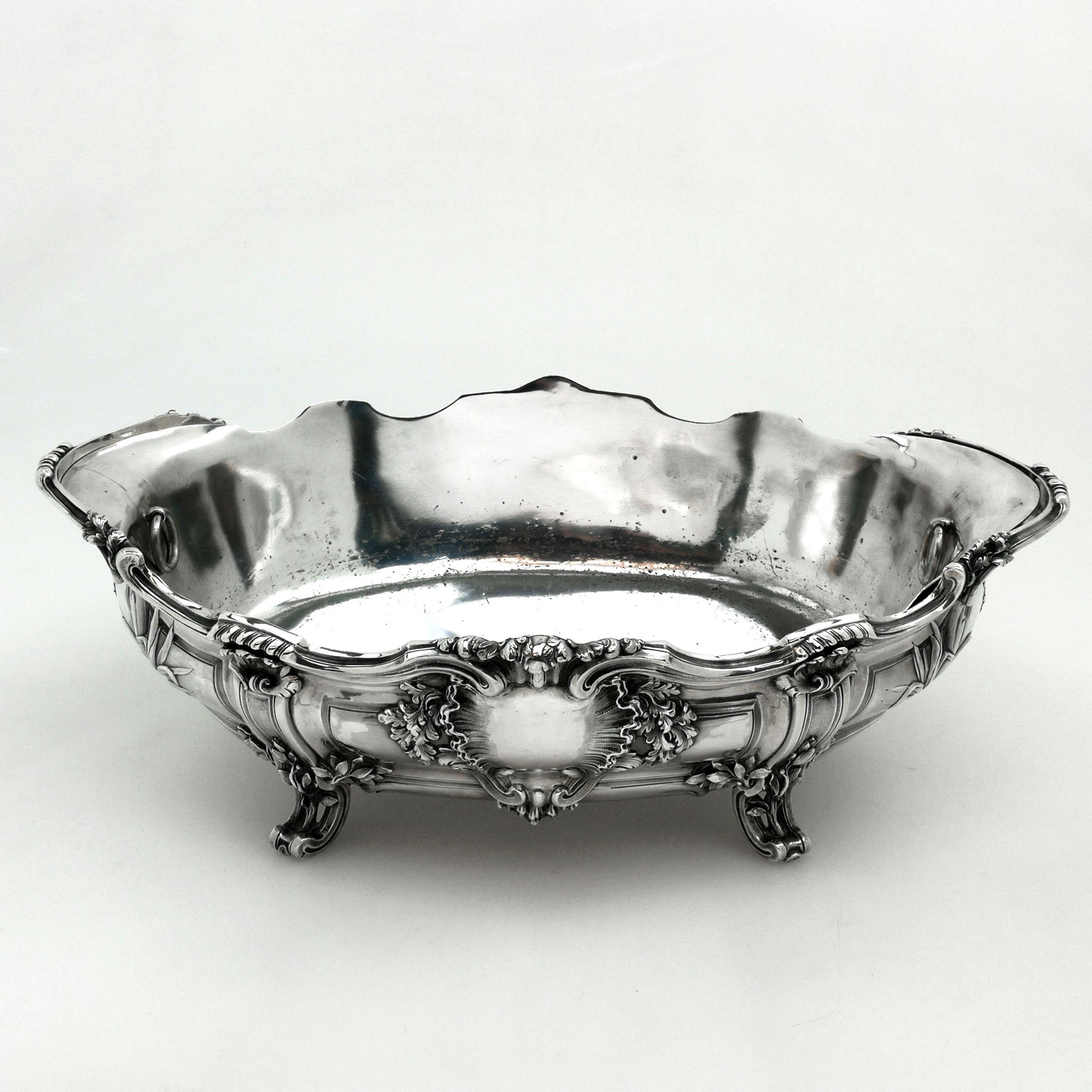 A magnificent Antique French Silver Jardiniere standing with a substantial oval shape and decorated with an impressive chased & applied floral designs. The Centrepiece Dish stands on four ornate feel. The Jardiniere has a removable silver plated