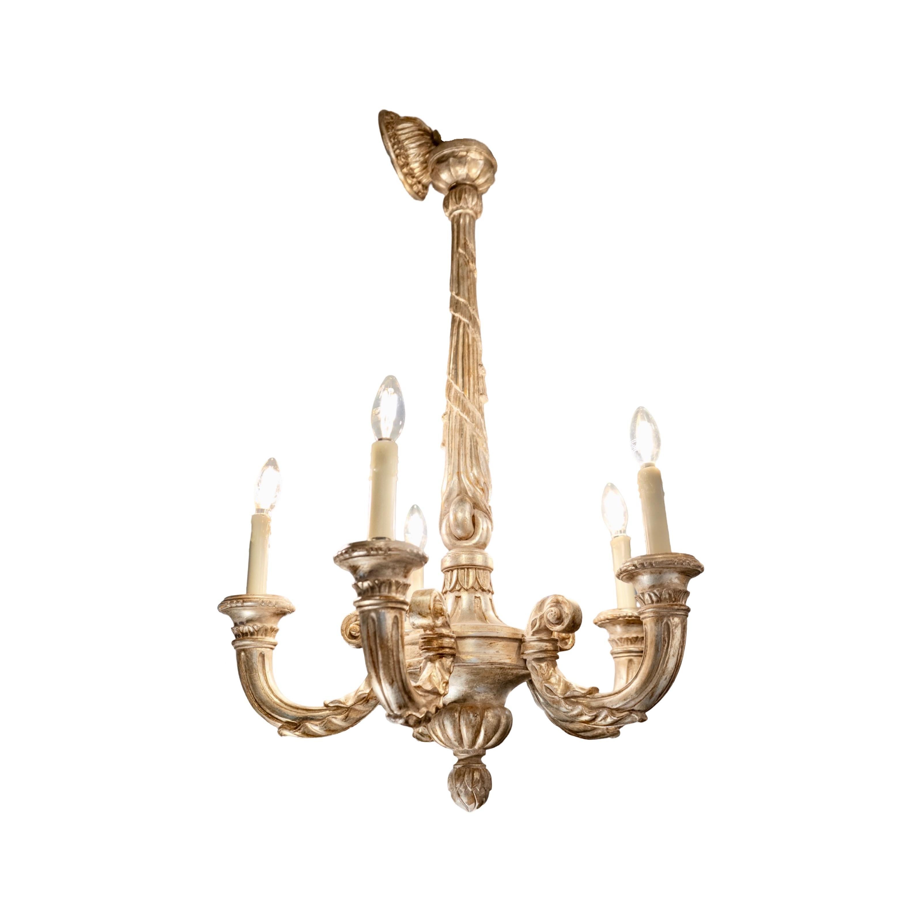 An antique French chandelier from the 1940s, beautifully hand-carved from wood and finished in silver lead. Elegant and timeless, it has been professionally wired and is ready for installation — a striking statement piece with classic European charm.