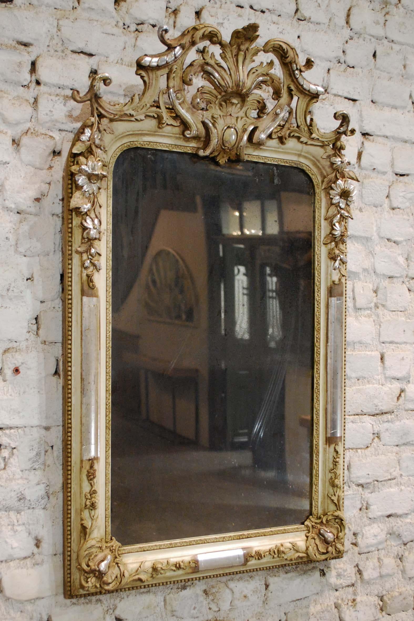 silver french mirror with ornate crest
