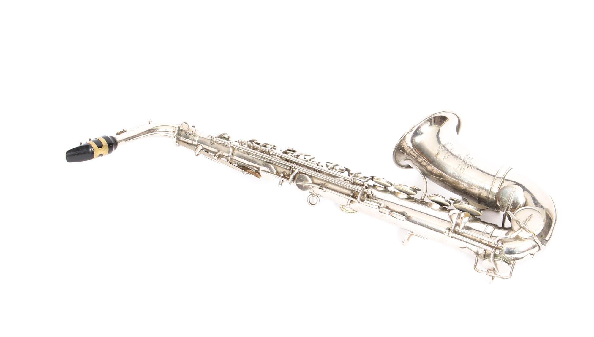 This is a splendid and rare antique French silver plated saxophone with the original playing booklet by the world-famous manufacturer of musical instruments, Couesnon et Cie, and dating from 1929.
 
Distinctively made of silver plate, as compared