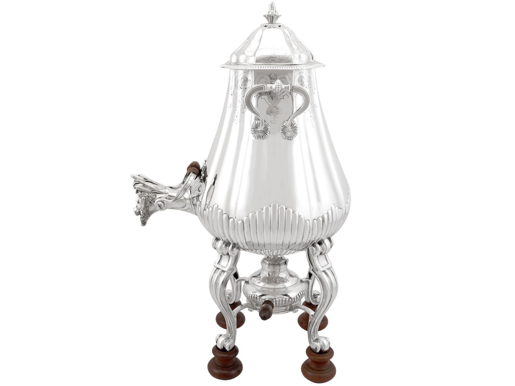 An exceptional, fine and impressive antique French silver samovar; an addition to our antique silver teaware collection.

This exceptional antique French silver samovar has a rounded square shaped form supported by four scrolling legs to button