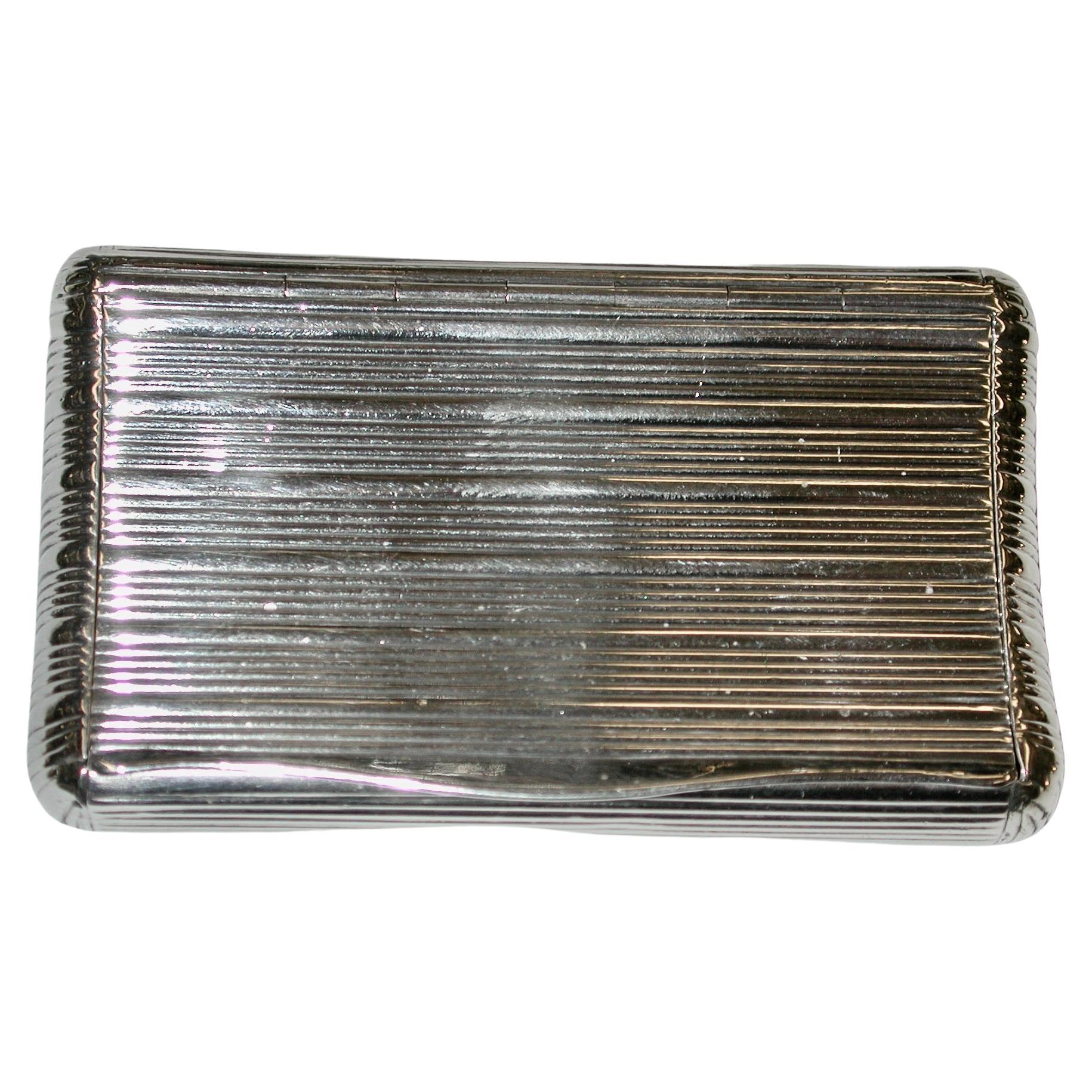 Antique French silver snuff box, Dated 1820, Made In Paris
Typical ribbed decoration all over with a nice flush hinge, and a curved shape to fit nicely in the pocket.
These days would make a superb pillbox, as it has a nice tight fit.
This box is