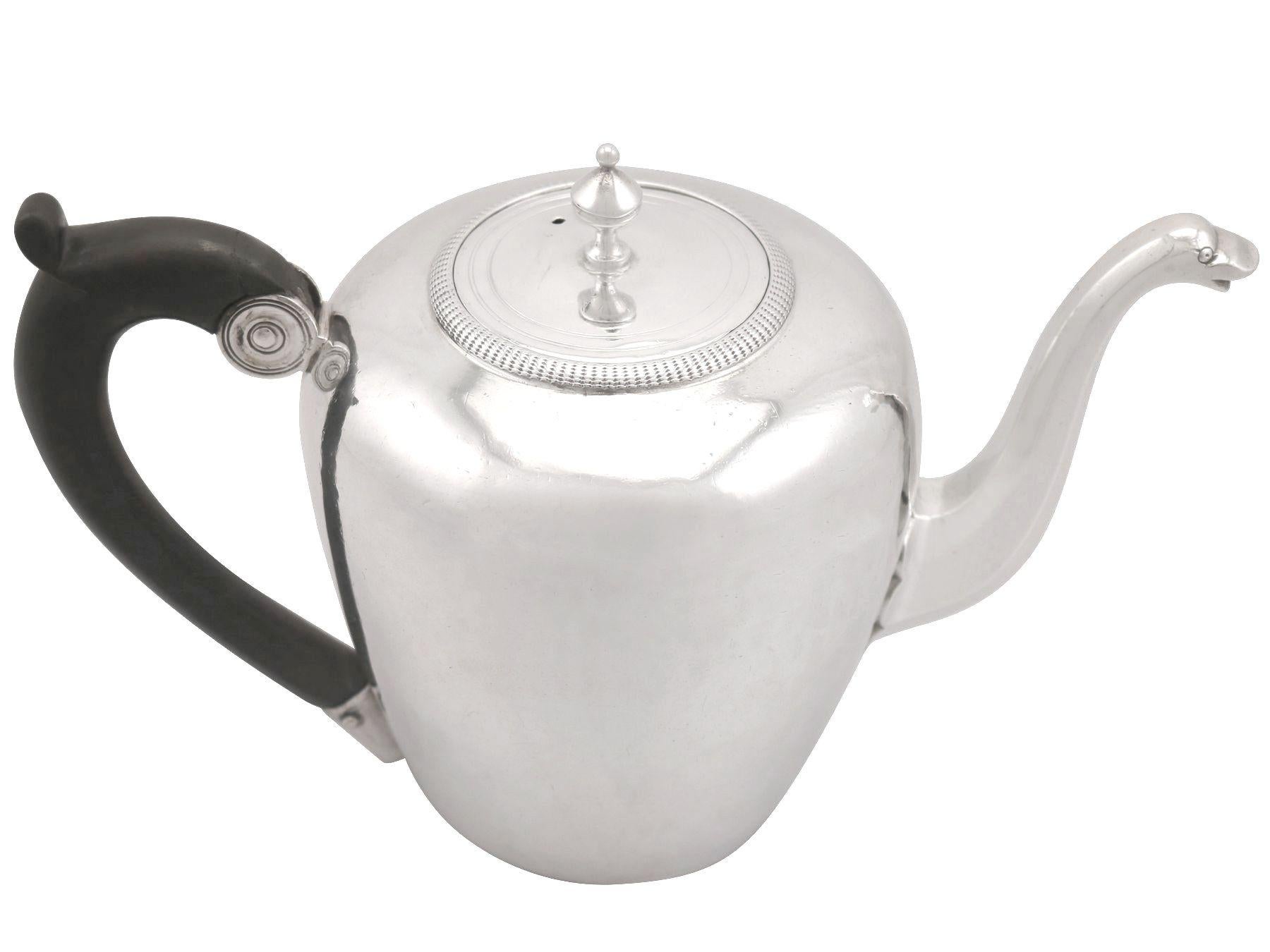 An exceptional, fine and impressive antique French silver teapot; an addition to our silver teaware collection.

This exceptional antique French silver teapot has a circular rounded form.

The surface of the body is plain and unembellished, with
