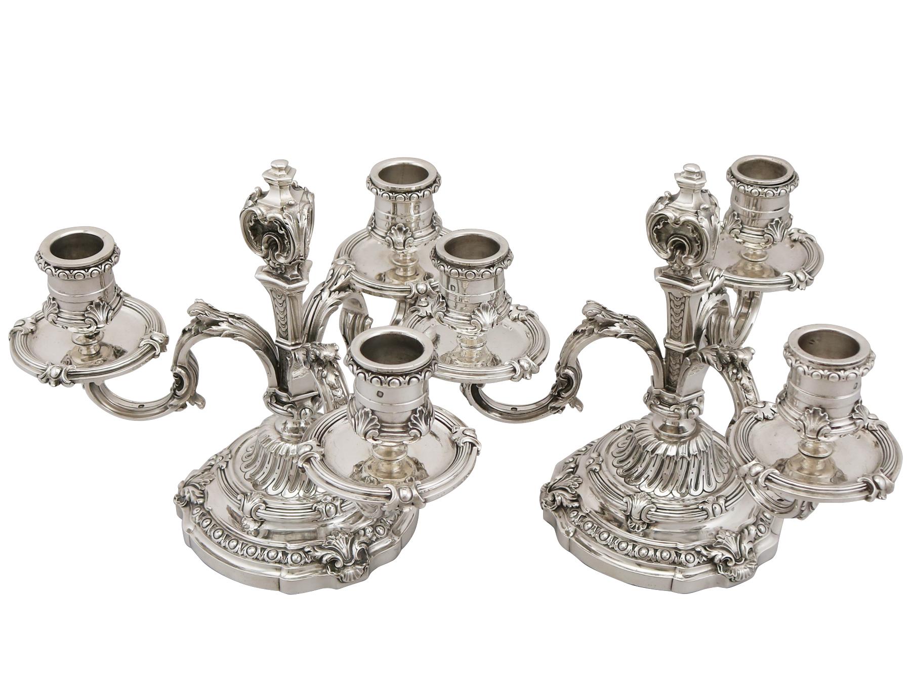 An exceptional, fine and impressive pair of antique French silver three-arm candelabra; an addition to our ornamental silverware collection.

These exceptional antique French silver candelabra have a plain circular form, reflecting the Louis XV