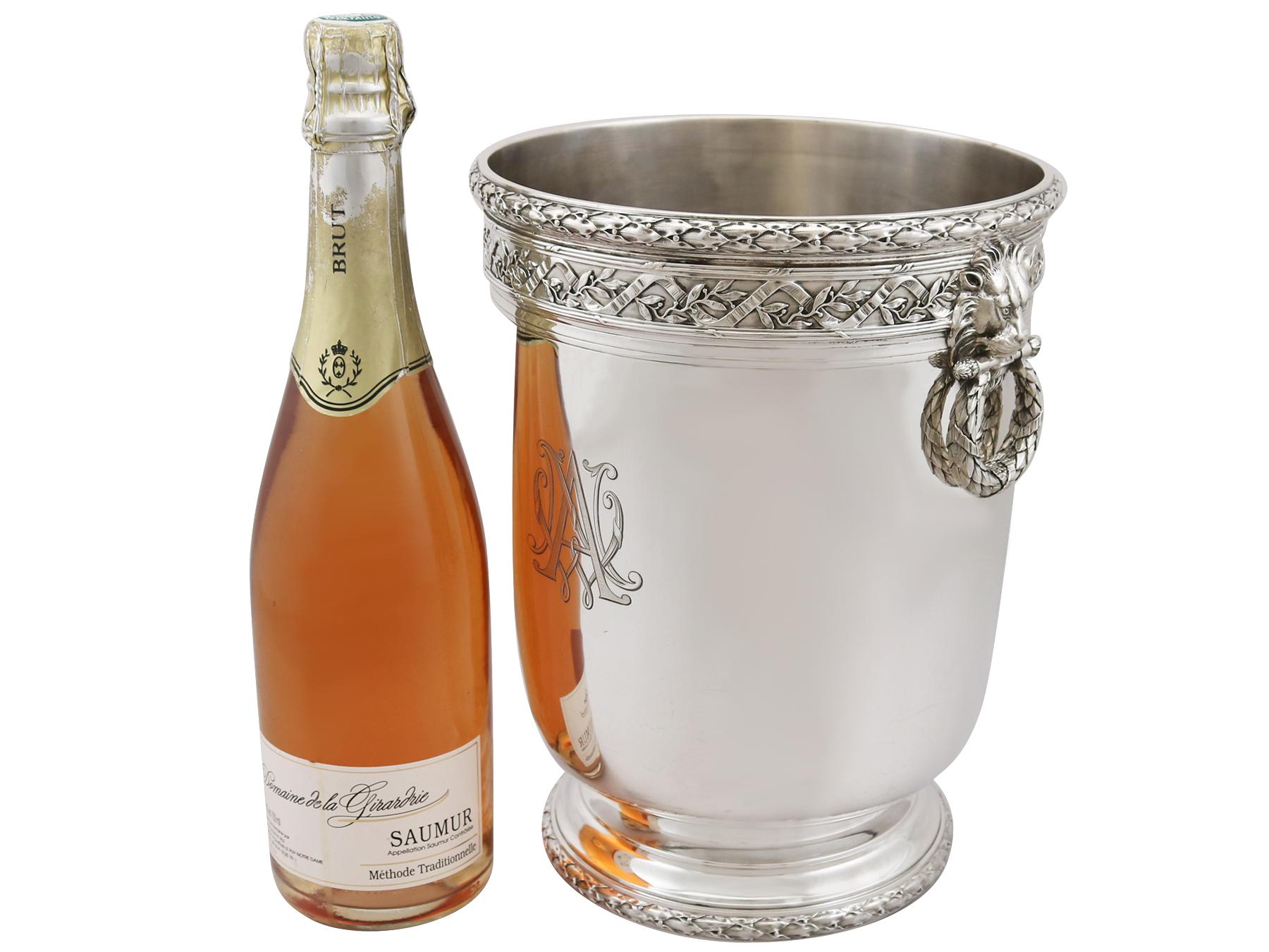 An exceptional, fine and impressive antique French silver wine or champagne cooler; an addition to our presentation silverware collection.

This exceptional antique French silver wine cooler has a cylindrical rounded form.

The surface of this