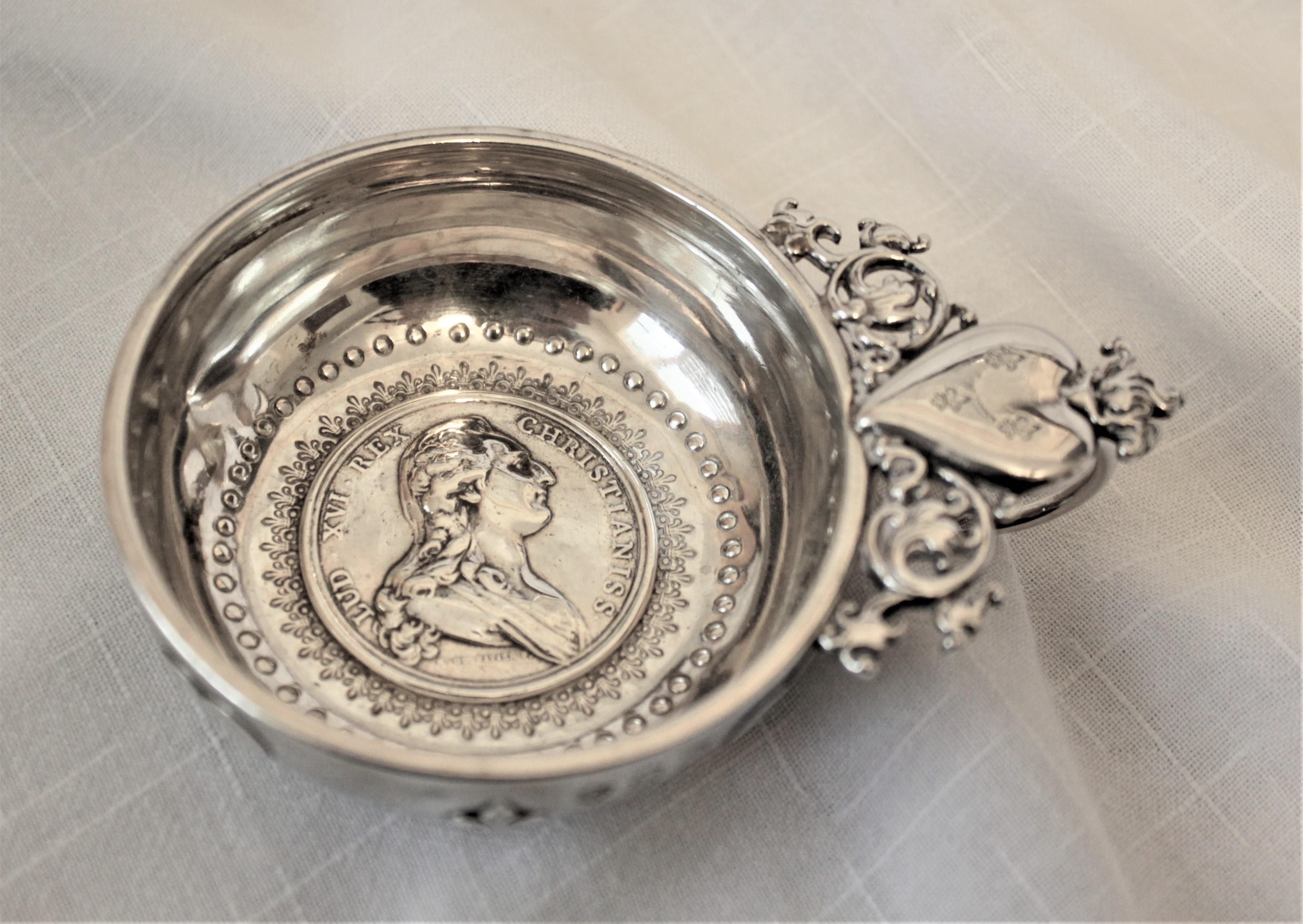 This very unique and ornate antique silver wine taster was made in France in circa 1780 and is hallmarked, however the maker cannot be identified so is being deemed 'unknown'. The wine taster is very intricately decorated with chased hearts around
