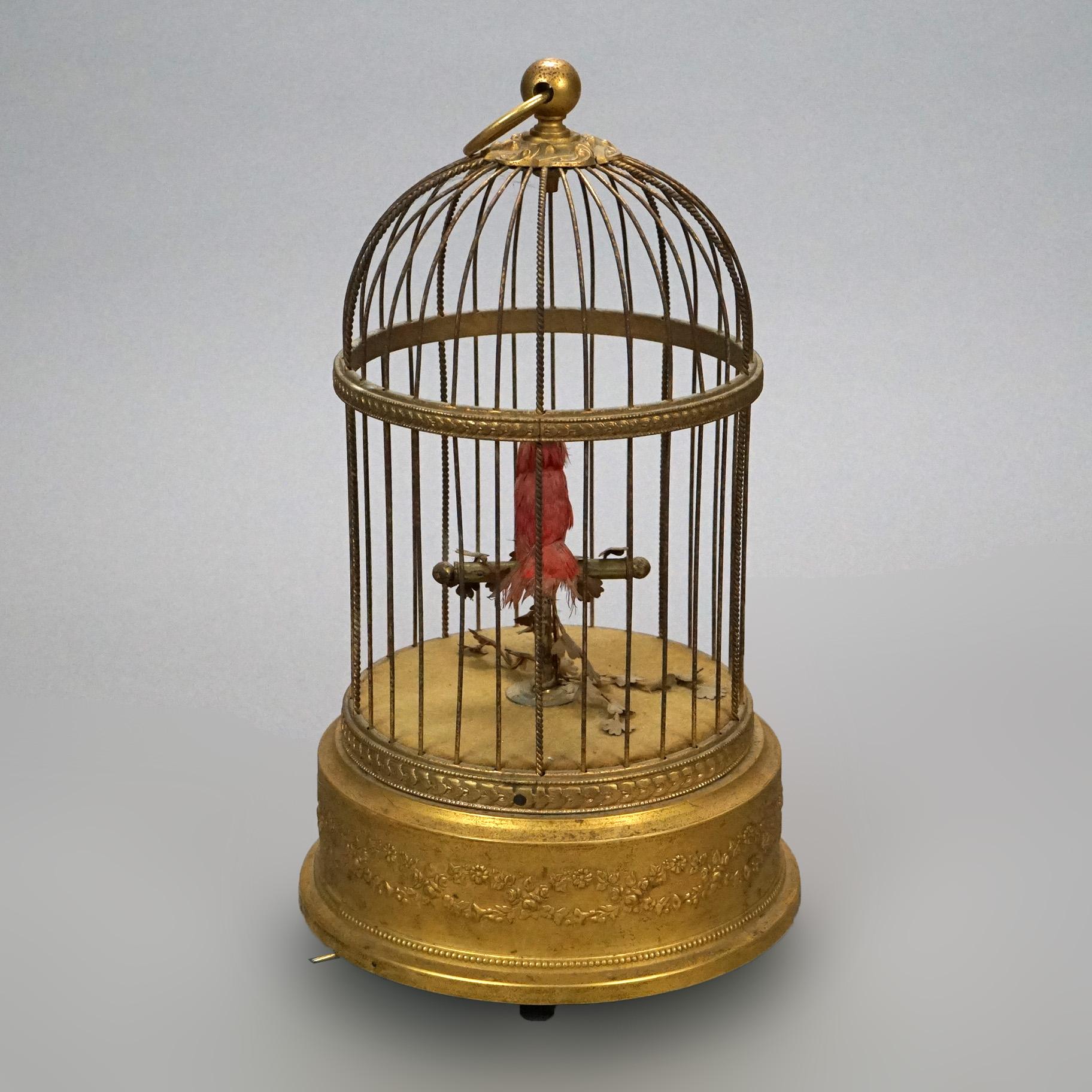 An antique French automaton offers singing bird in cage with scroll and foliate decoration, wind-up operation, stamped on base as photographed, c1890

Measures- 11'' H x 6.25'' W x 6.25'' D.