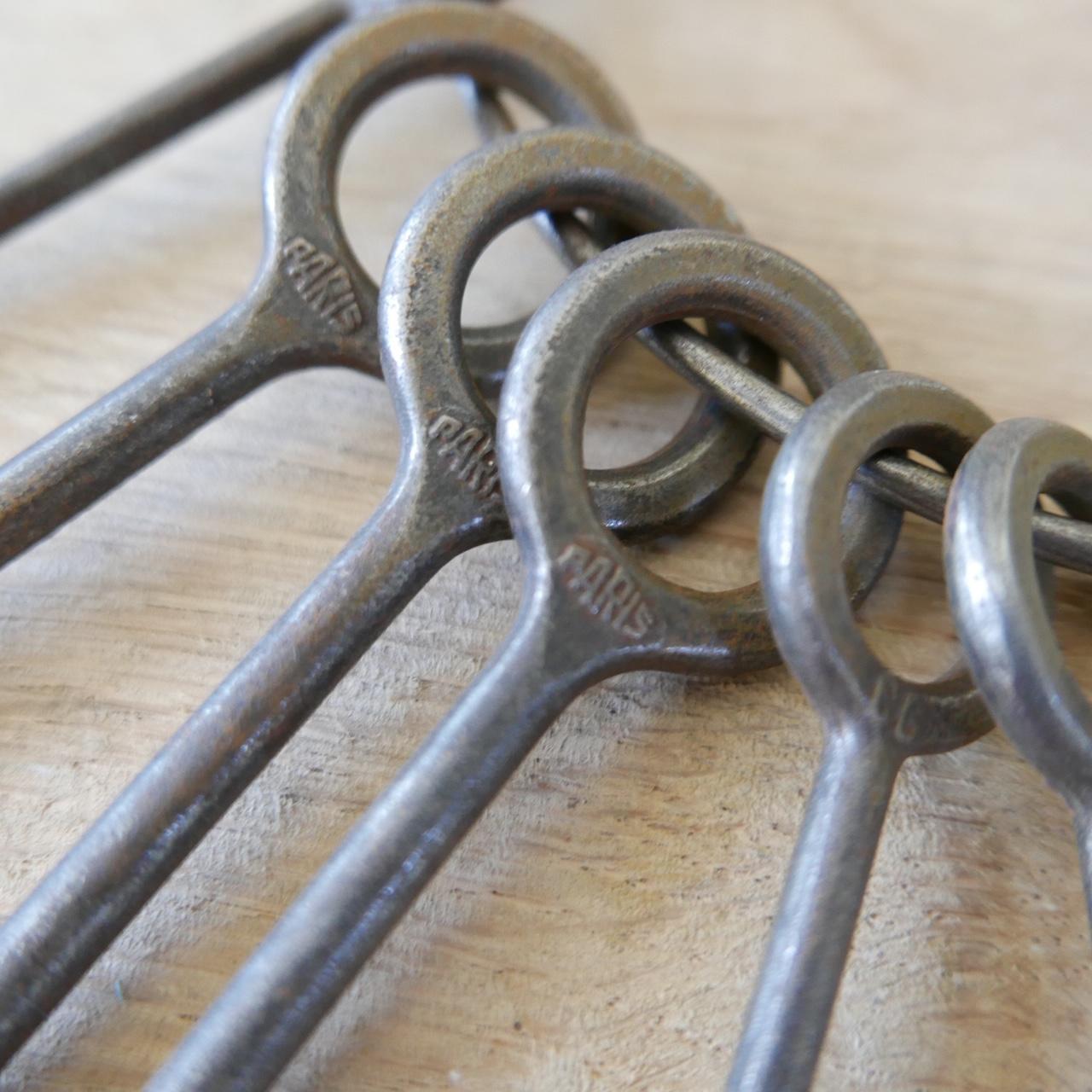 A set of scarce French lock pick keys.

French, 19th century or earlier.

Decorative curio perfect for a shelf, coffee table.

Dimensions: 30 W, 27 H, 2 D all in CM.