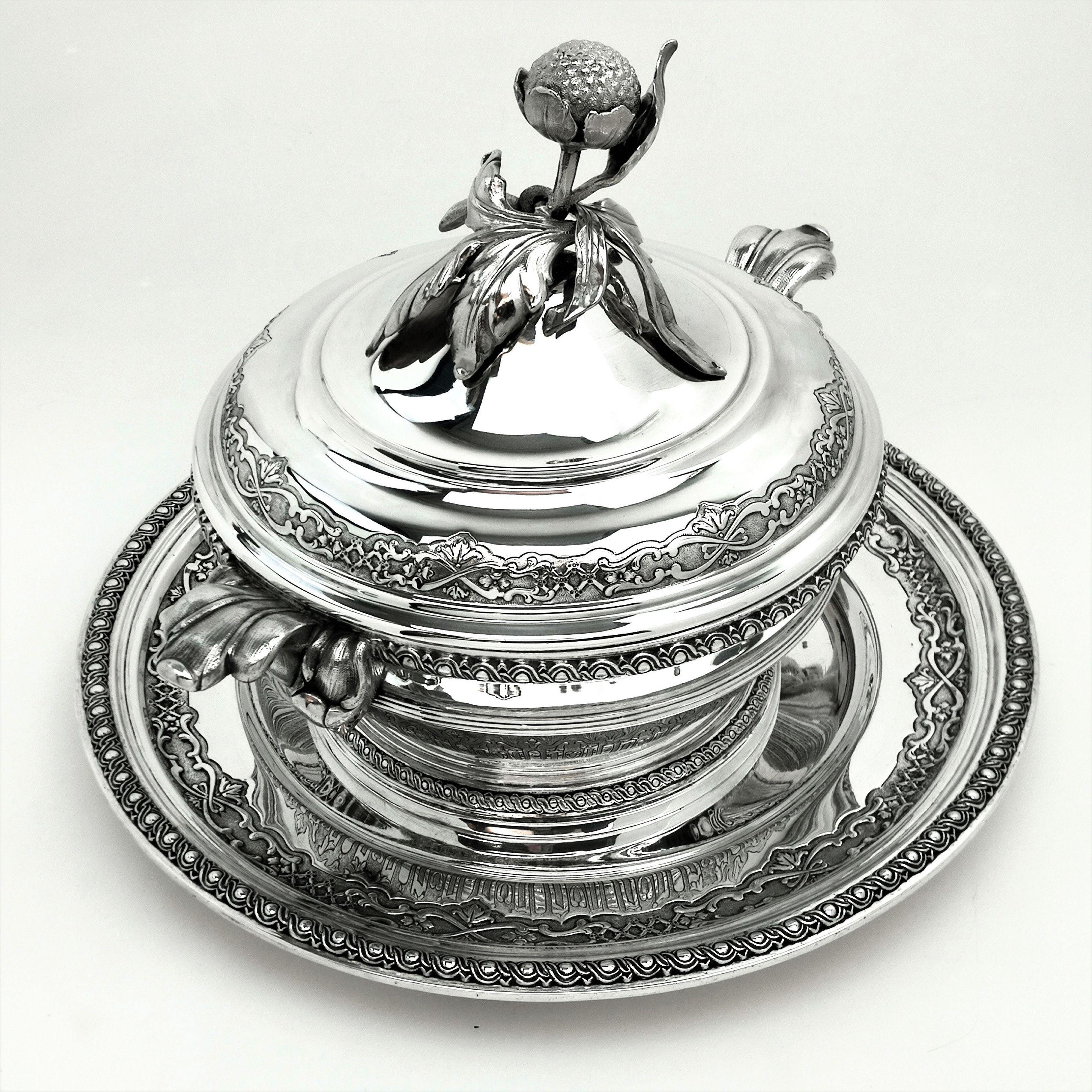 A magnificent Antique Solid Silver Soup Tureen on Stand. This Antique silver lidded Soup Tureen stands on a wide circular Platter that can be used separately as a Serving Platter. The impressive circular Tureen features a notably large Finial and
