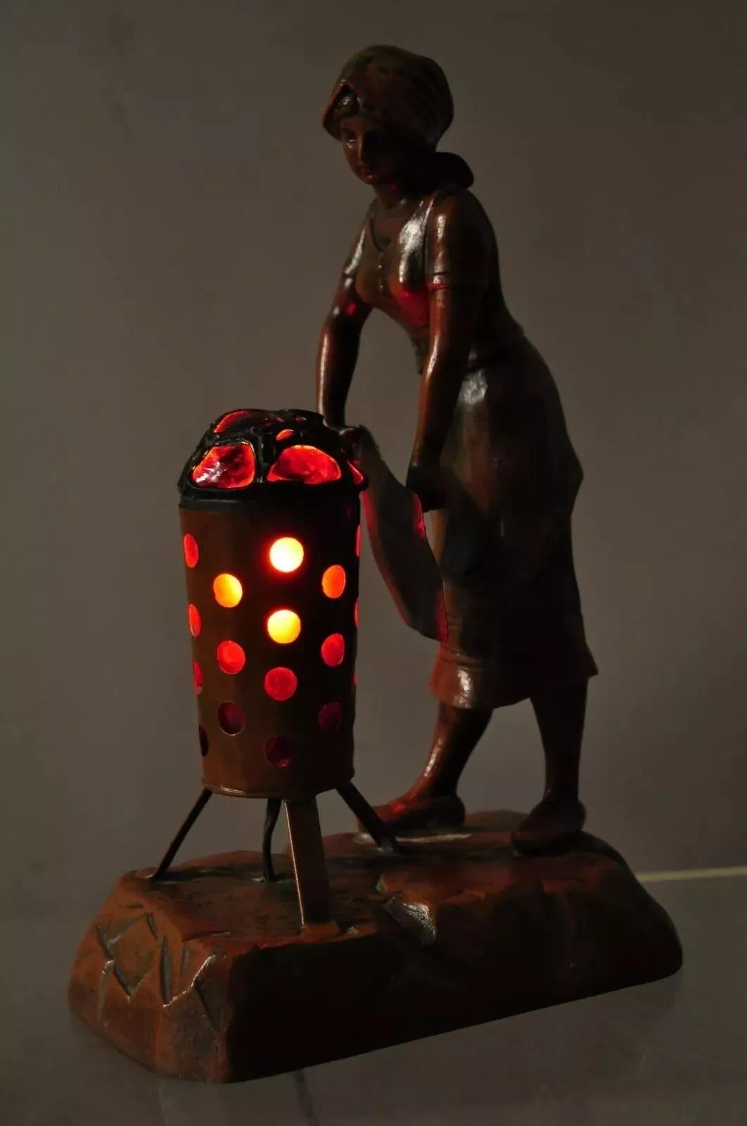 Sconosciuto Antique French Spelter Metal Figural Woman by Coal Fire Statue Lamp attr Raineri in vendita