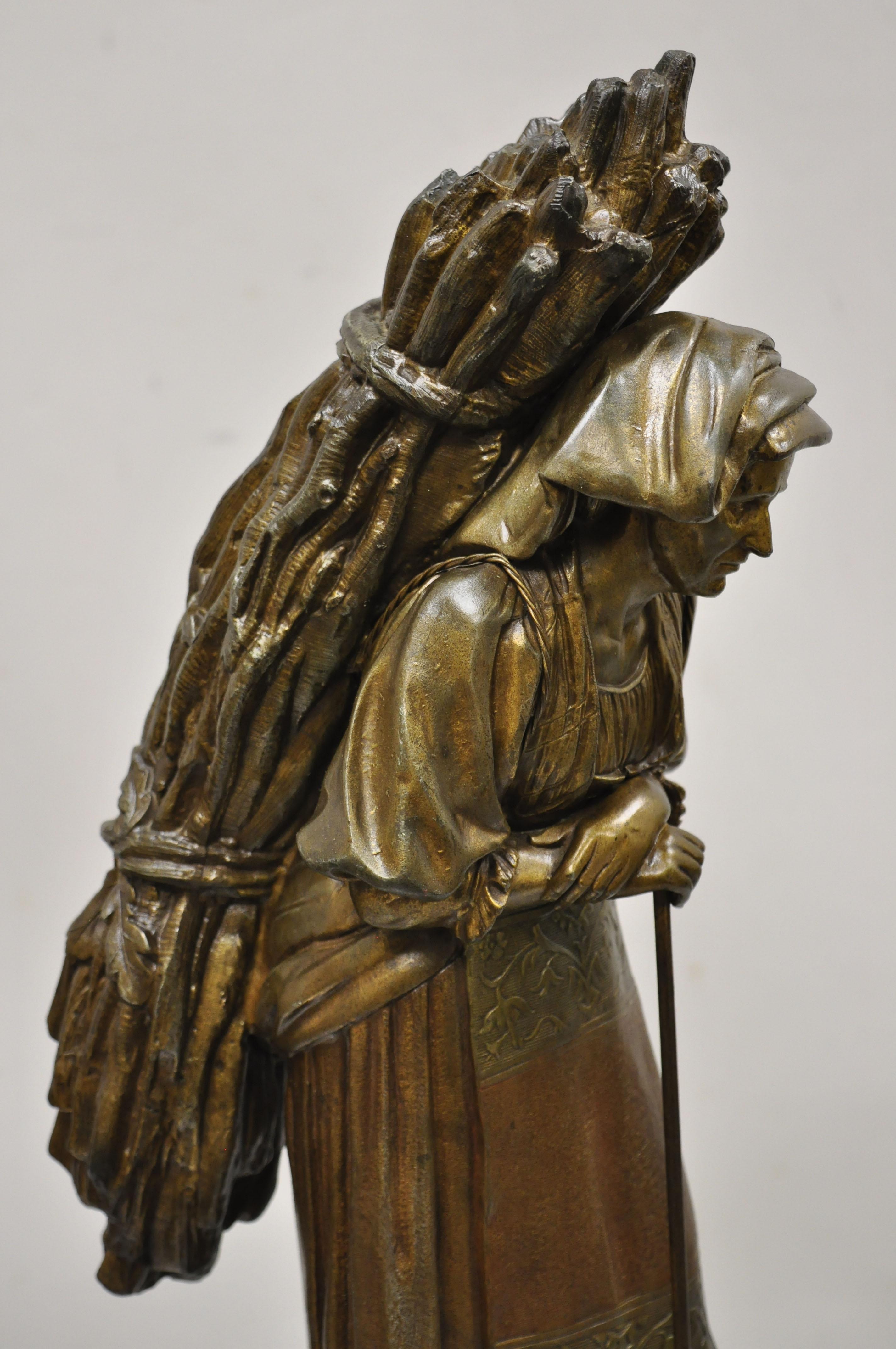 Français Sculpture française ancienne en acier inoxydable représentant une femme transportant un bouquet de bâtonnets en train de faire une randonnée en vente