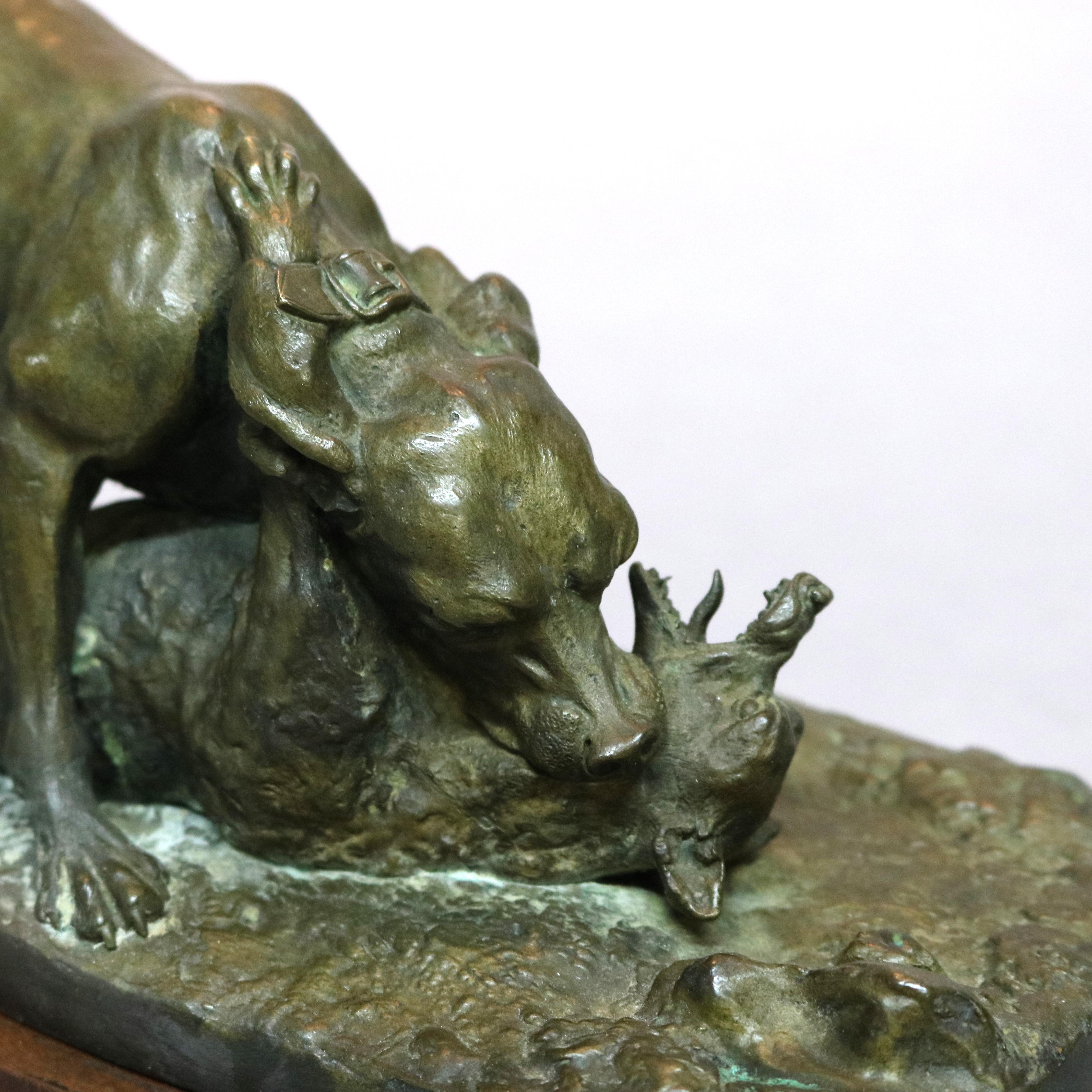An antique French sporting dogs sculpture offers cast bronze figure of hunting dog with fox, mounted on stepped wood base, c1890

Measures: 6.75