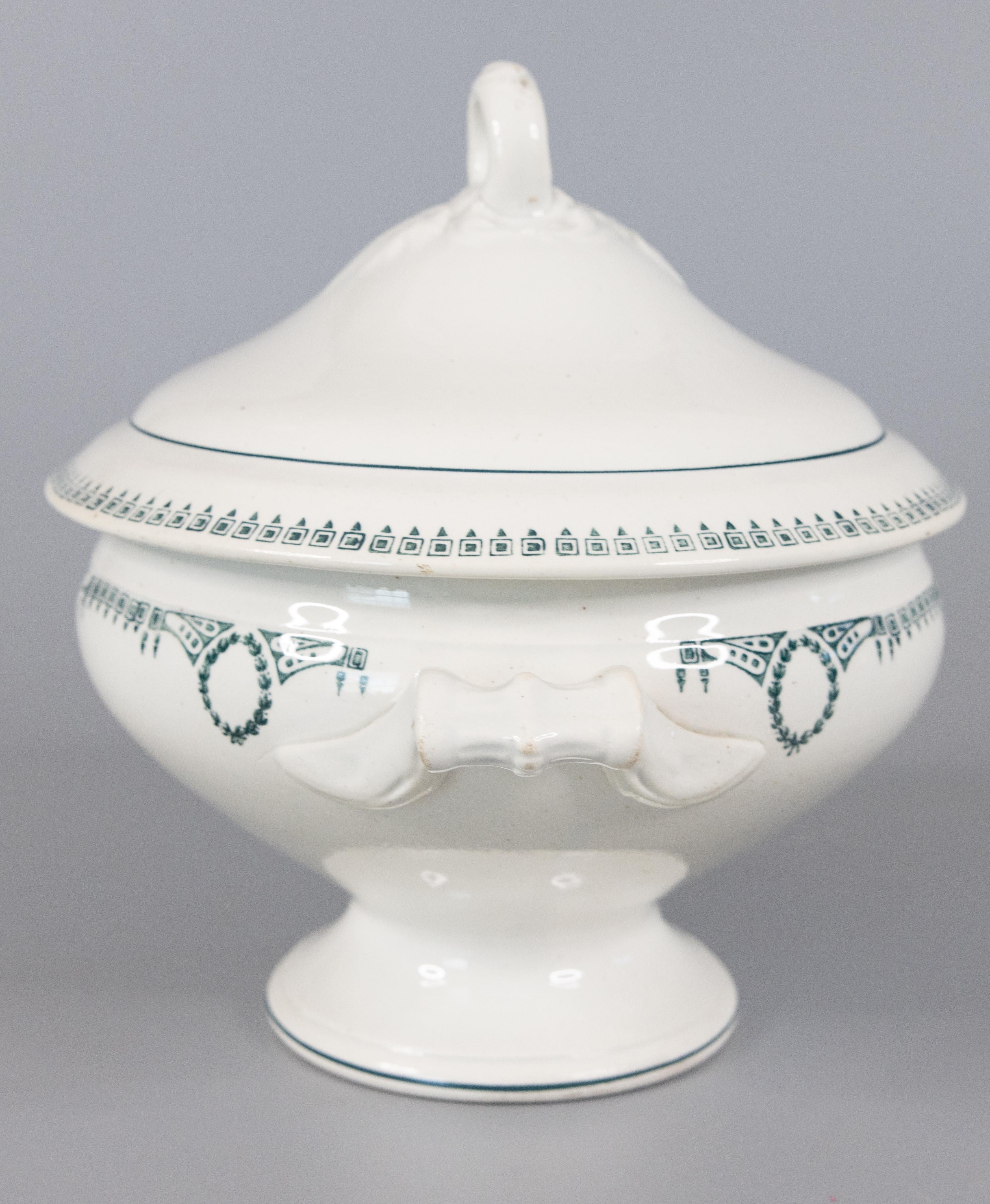A gorgeous antique white ironstone lidded soupiere made in France by St. Amand, circa 1920. Marked 