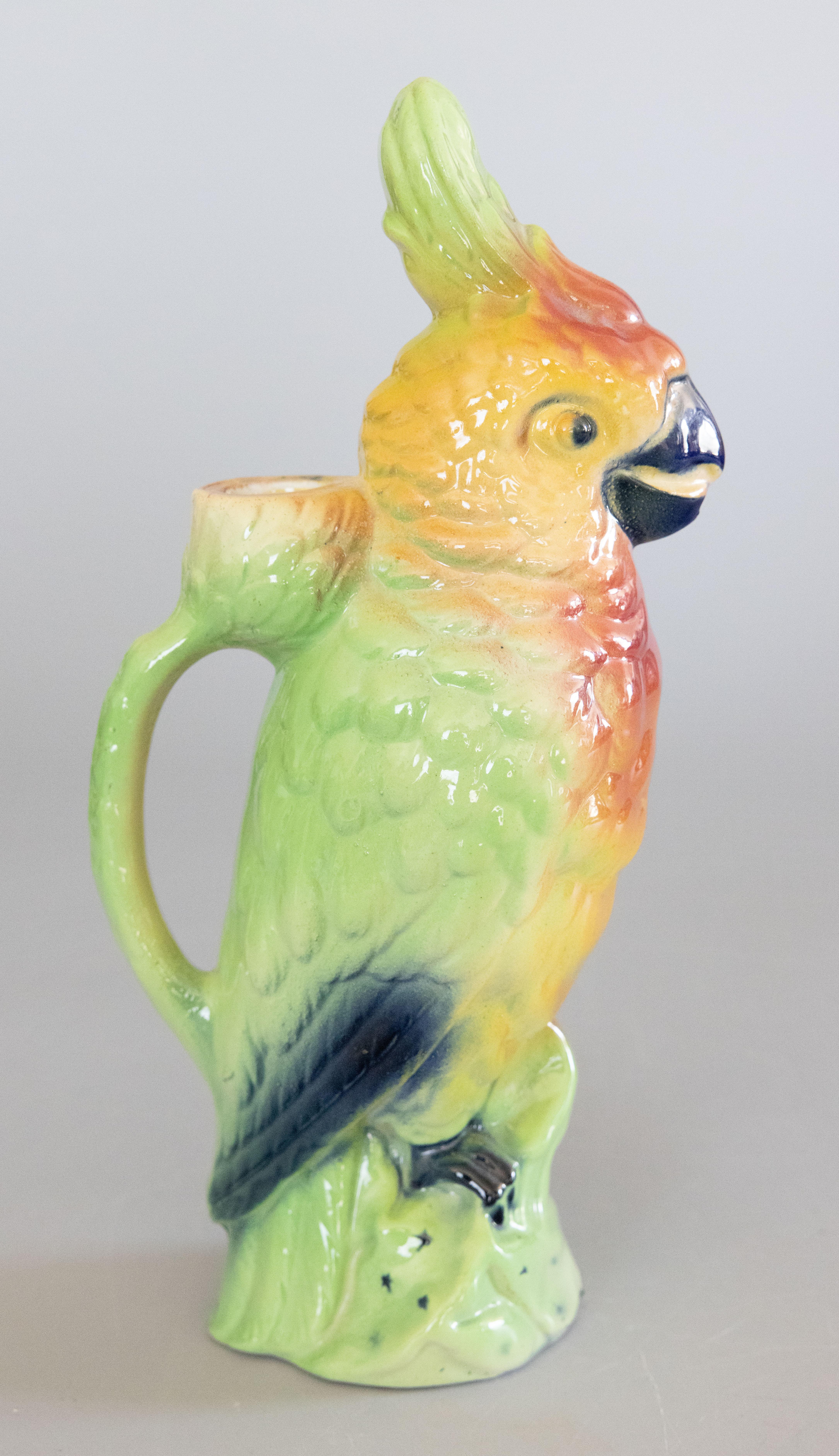 A gorgeous antique French majolica parrot absinthe pitcher decanter or figural jug hand painted with beautiful vibrant colors, circa 1900. This pitcher was made by Keller & Guerin at their St. Clement faience factory in France and is signed on the
