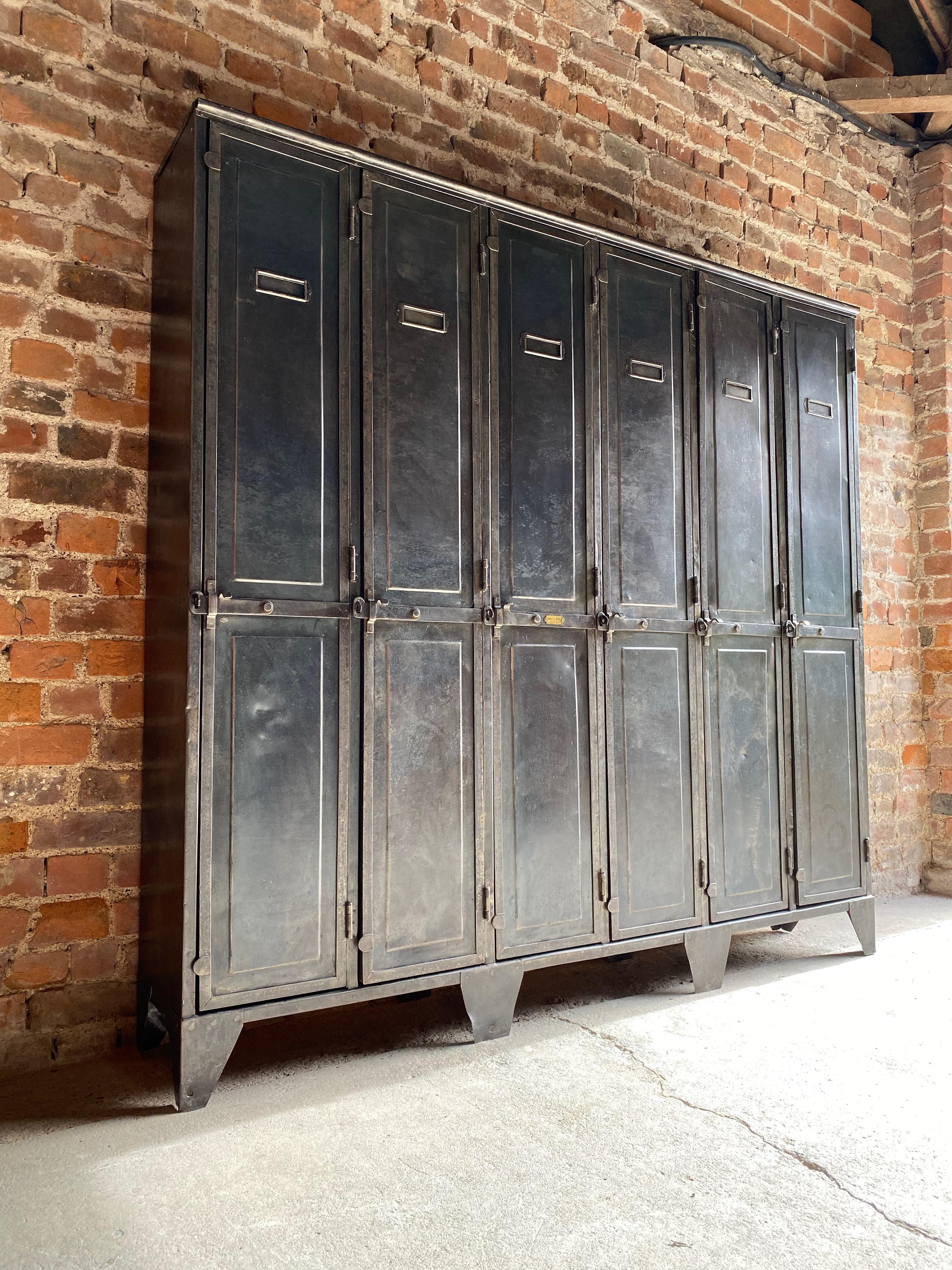 Antique French steel school lockers Laugel & Renouard St Die Vosges, circa 1890

Exceptional antique French steel school lockers by Laugel & Renouard St Die Vosges, France, circa 1890, The bank of six-door lockers, each door with closing latch and