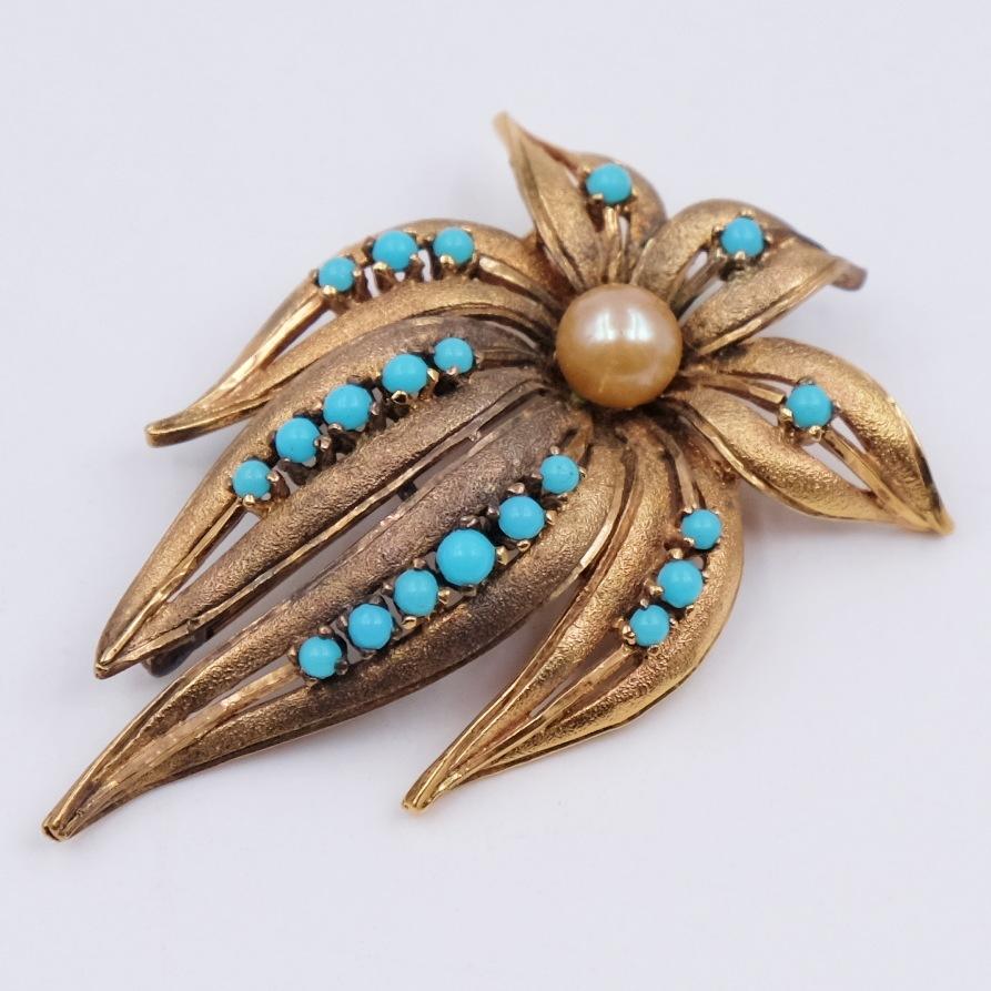 Elegant antique brooch beautiful designed looks perfect with any outfit even a formal one. Seven saw-toothed edged leaves are decorated with a faux pearl in the center and surrounded with tiny faux turquoise cabochons. Made of sterling silver this