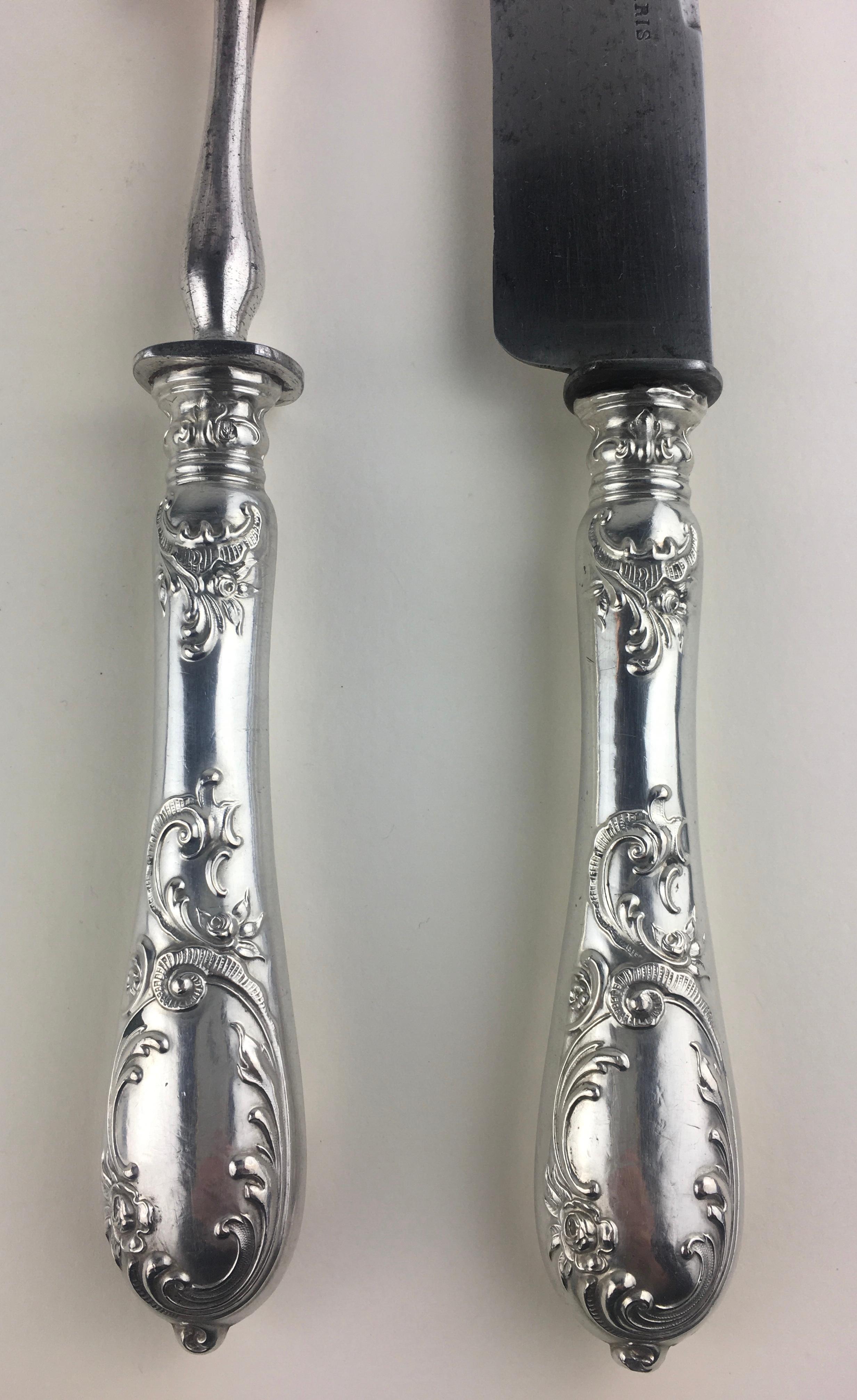 Art Nouveau French sterling silver carving set comprised of a large knife stamped Paris and a fork, circa 1880-1930

The set have a fantastic holly motif in Art Nouveau style.

Good condition consistent with age, some minor scratches and darkening