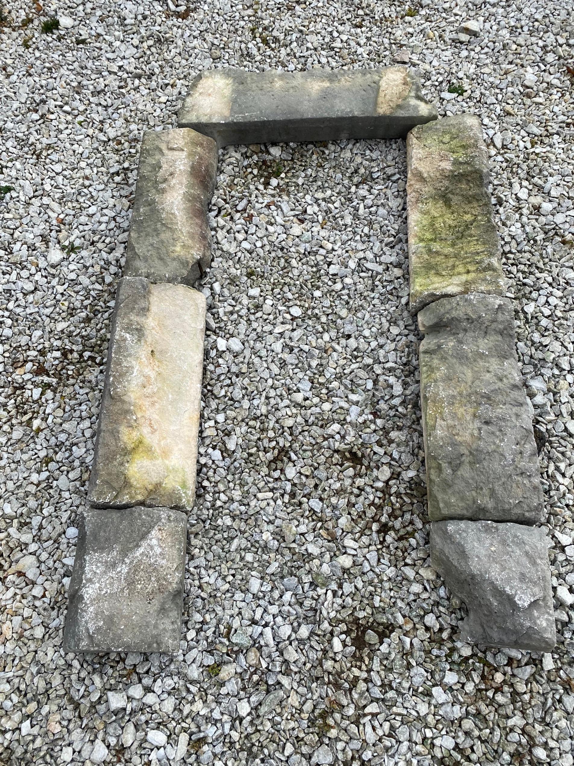 18th Century or earlier, rustic French country portal door frame for garden wall entrance. Stones are hand-carved in grey stone for a country farm house.
A stone mason should be able to make this work. the portal is rough but will definitely add