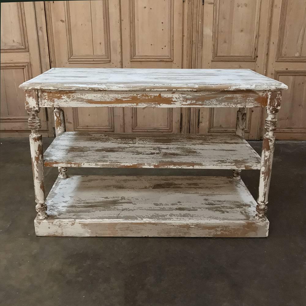 Antique painted counter features a scraped painted finish that is so in vogue today! Ideal as a choice for a kitchen island, it features three tiers which includes a generous surface, all supported by corner columns, packaged in a great size for a