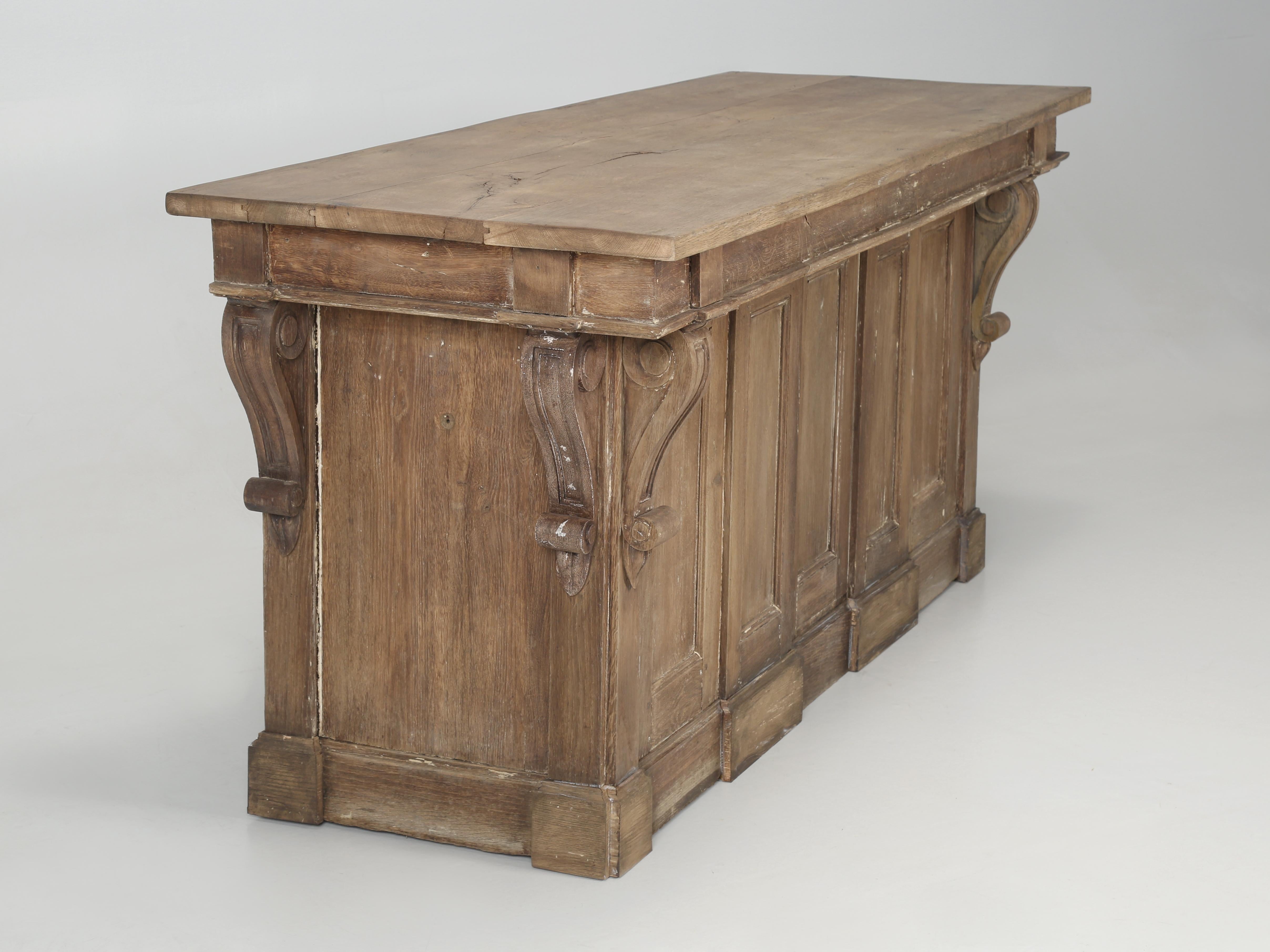 Antique French Store Counter Repurposed by our Old Plank Artisans into a Country French Style Kitchen Island. The Antique White French Oak from our Store Counter had just the perfect amount of Original 100-year-old Patina, that our Old Plank