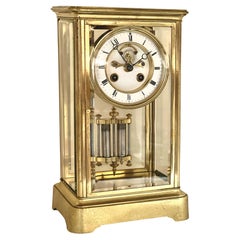 Antique French Striking Four Polished Brass and Glass Mantel Clock