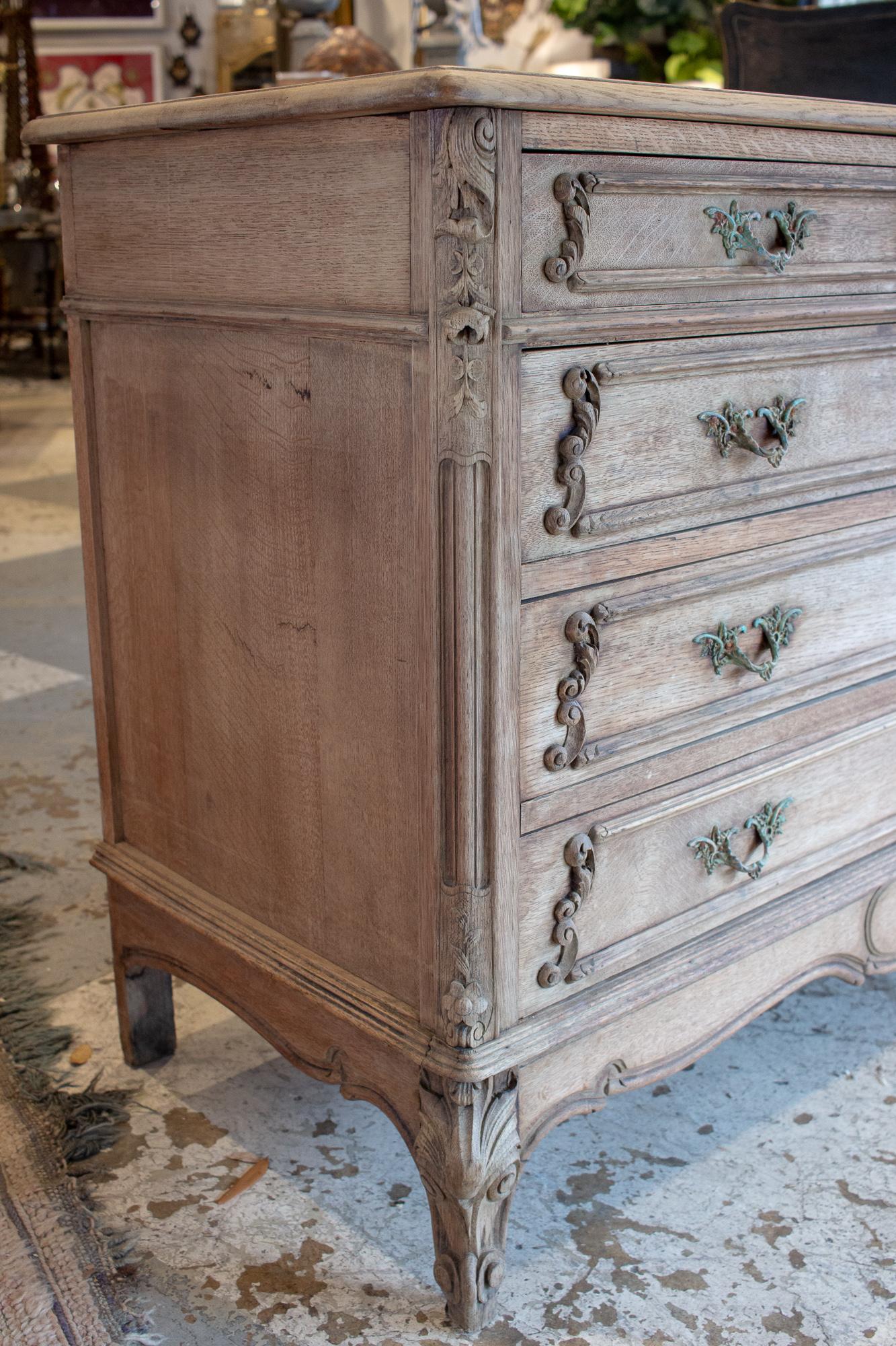 Hand-Carved Antique French Stripped Wood Five-Drawer Commode with Detailed Carvings