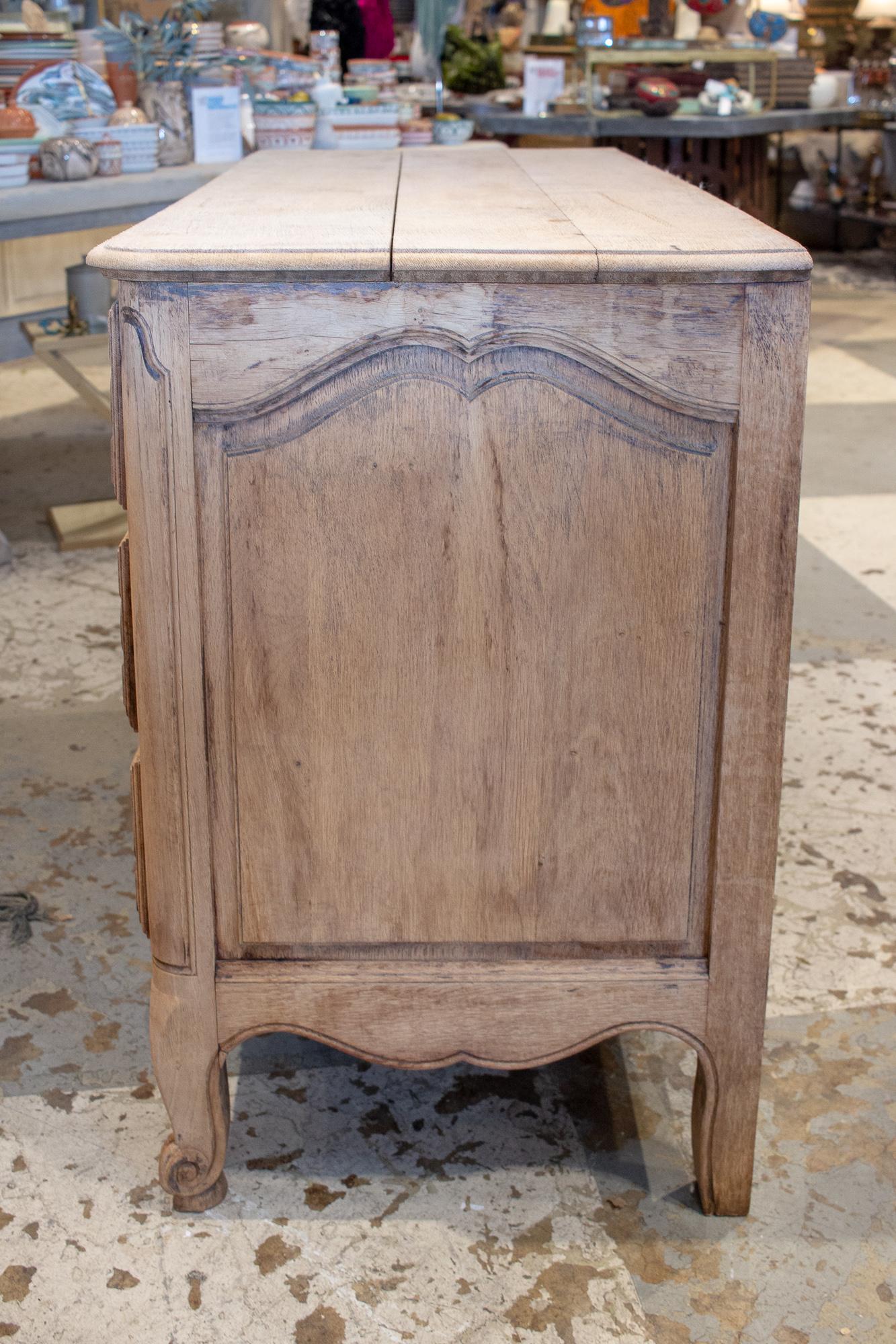 Antique French Stripped Wood Three-Drawer Commode with Carved Details In Good Condition In Houston, TX