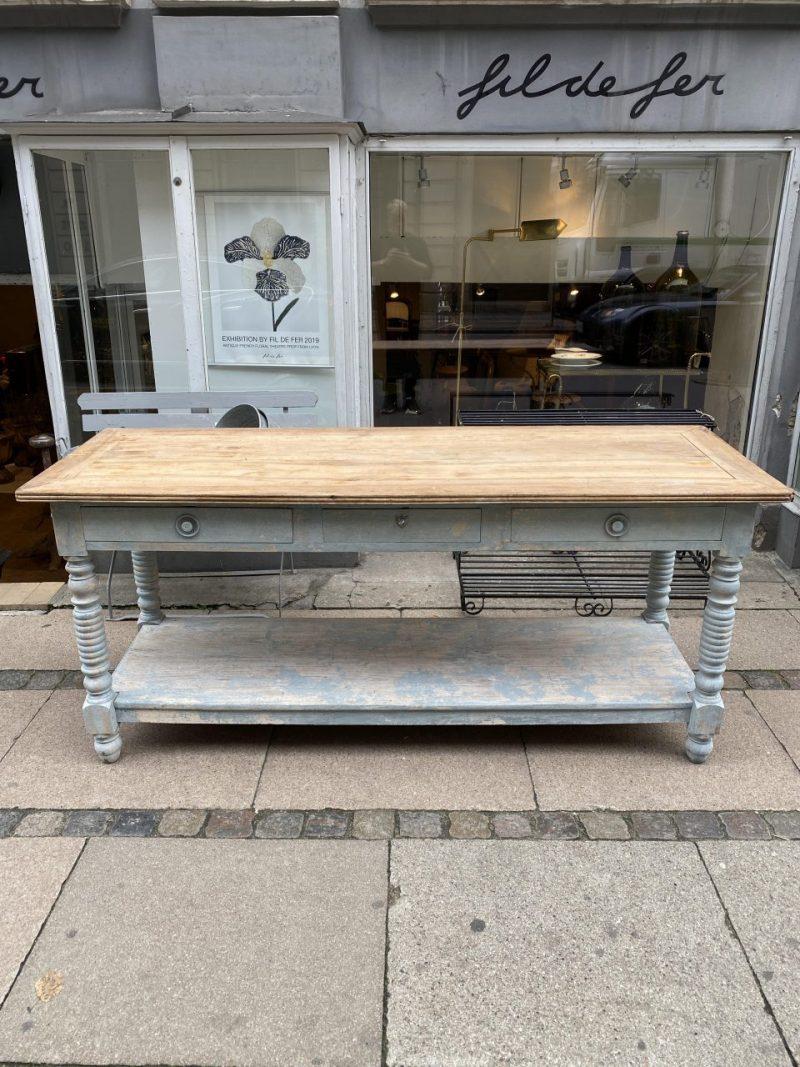 Sophisticated, stunning and well-proportioned console table / drapery table, painted a lovely sky blue tone. France circa 1900. Originally boutique inventory, for the storage, presentation and measuring of fabric rolls / textiles.

Elegant yet also