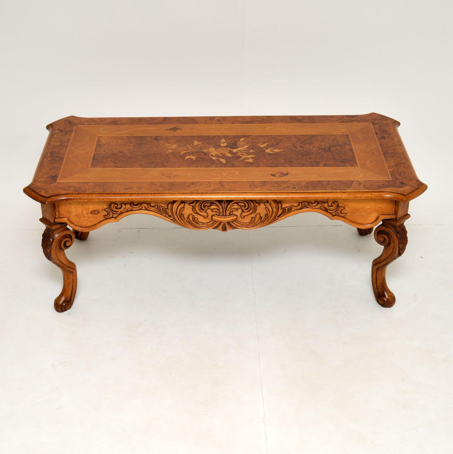 A stunning and large coffee table in the antique French style. This dates from circa 1950s.

It is of amazing quality and has impressive detail throughout. There is beautiful carving on the sides and the legs, this has a gorgeous overall shape.