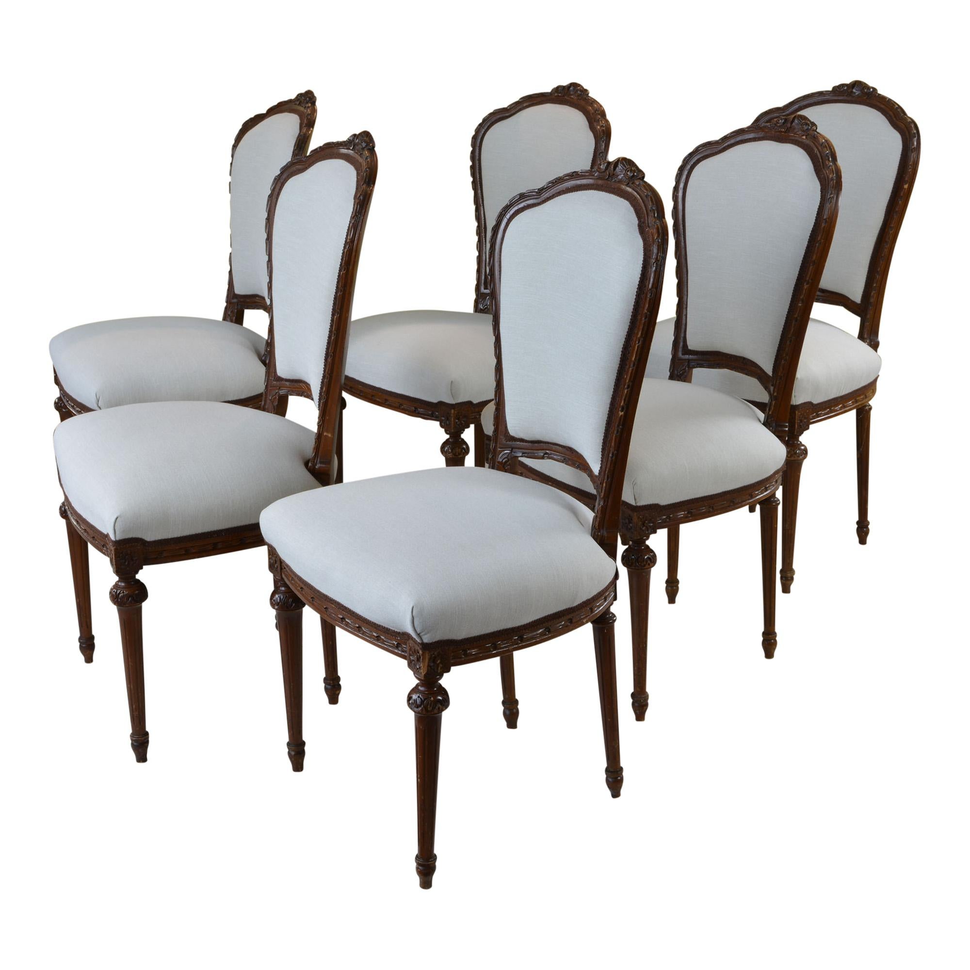 Nice set of 6 antique dining chairs were found at a fabulous New England estate sale. The home was full of beautiful European antiques. The chairs were right at home amongst the elegant decor. The dining chairs feature a lovely carved flower detail
