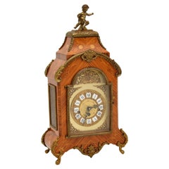 Ancienne horloge de cheminée en bois de roi de style français