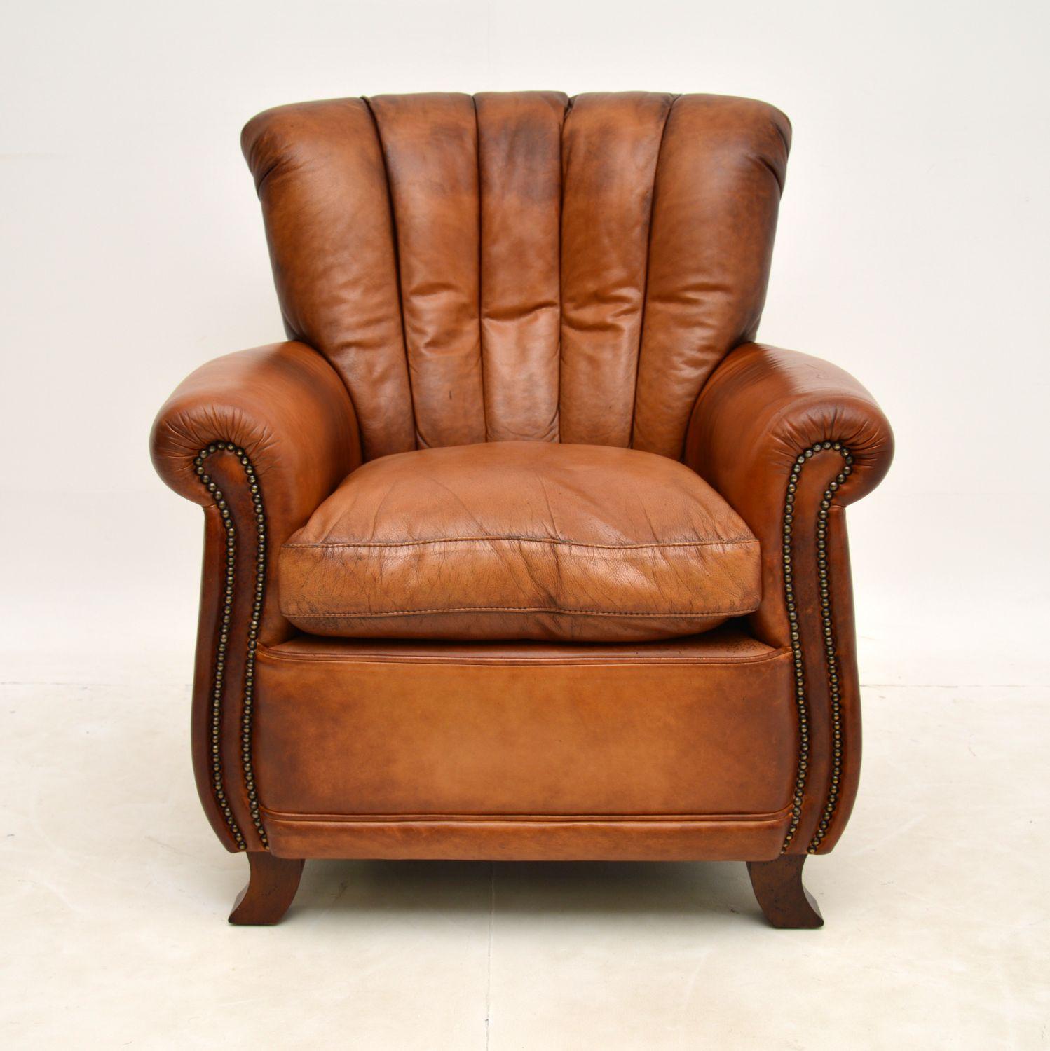 A smart and extremely comfortable vintage leather armchair, in the antique French style, which we would date from around the 1960’s period.

The quality is excellent, this is very well made and upholstered in beautiful brown leather. It has a
